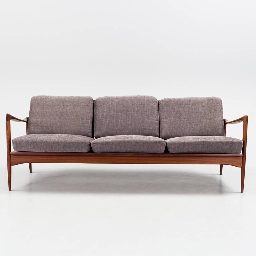 Rare Ib Kofod-Larsen 1960s Kandidaten Sofa in teak and fabric produced by OPE Mobler in Sweden. Very good condition.