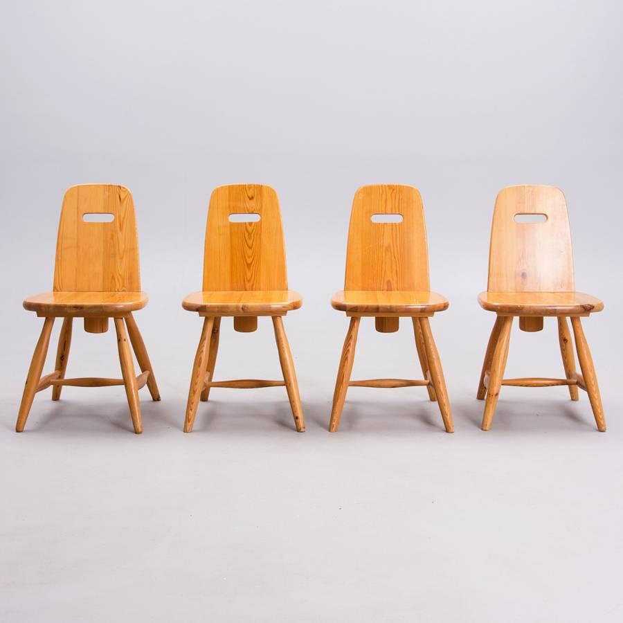 These set of four Pirrti chairs were designed by Eero Aarnio and manufactured by Laukaan Puu Turku in Finland. The chairs are made from pinewood and feature a special back handle. Great woodwork on the chair legs.  The condition is excellent.