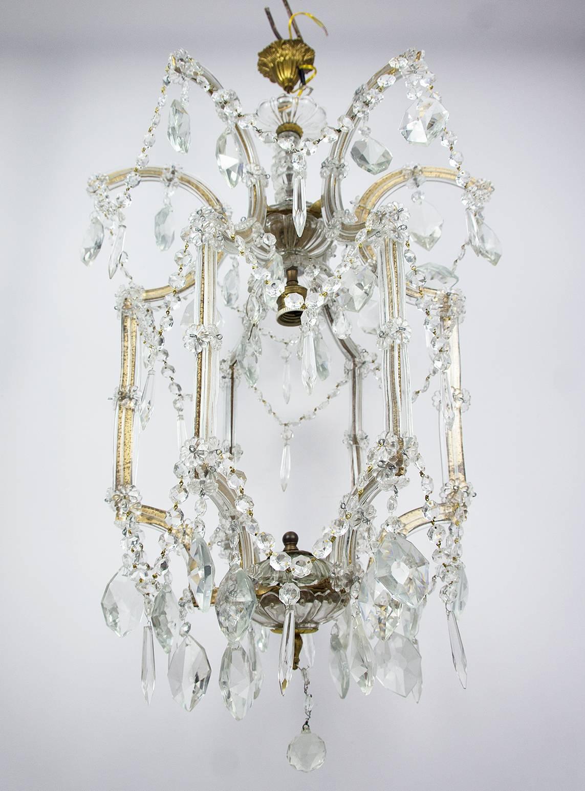 Beautiful vintage 1940s typical Italian Murano glass and crystal drop Maria-Theresa style cage chandelier on a brass frame.
Very good vintage condition
Acquired in Italy, shipping from Latvia
One light bulb
You must use professional electrician