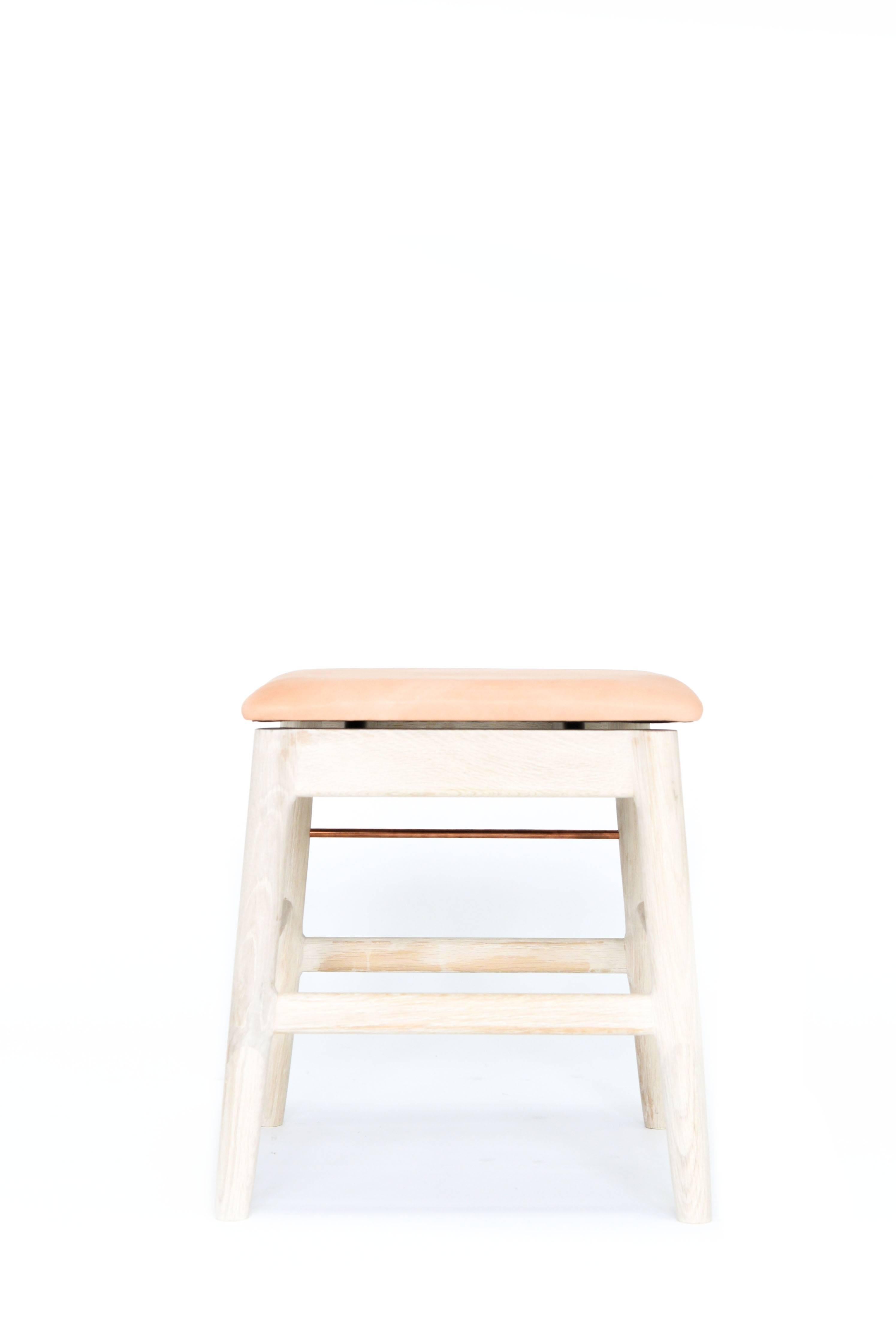 Handcrafted solid wood construction, featuring true copper or brass rods. Made in Los Angeles, California. 

Shown in white bleached oak, copper and veg tan upholstery. 

Wood type is available in ebonized oak, white oak, solid walnut, maple,