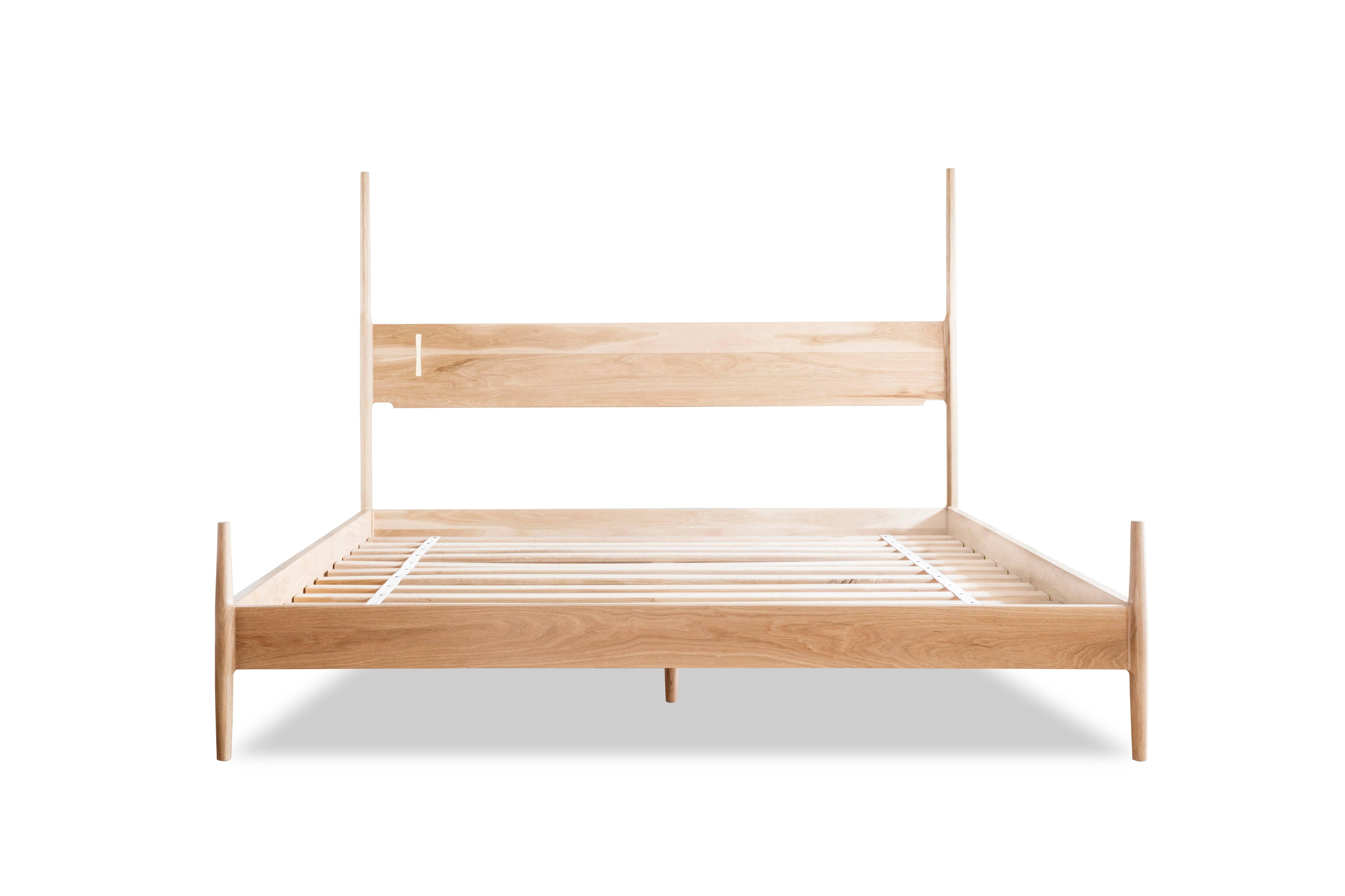 Posted bed with solid wood construction, hand-cut joinery and custom Dutchman brass joint. Handmade in Los Angeles, California.

Bed frame available in King or Queen, inquire for other mattress sizes.

As shown in natural oak.
Wood type is