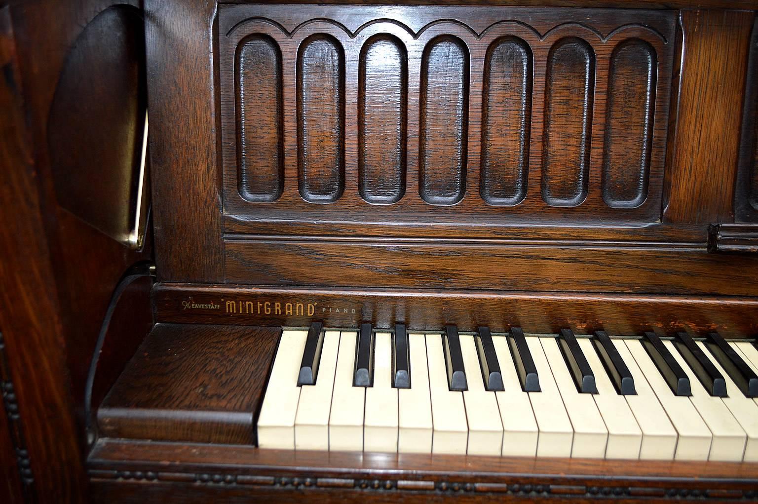 This is a beautifully made oak cased piano, made in the Gothic Revival style. The piano comes complete with matching oak stool. Eavestaff made reliable and quality sounding pianos and this piano is a perfect example of their high build quality. The