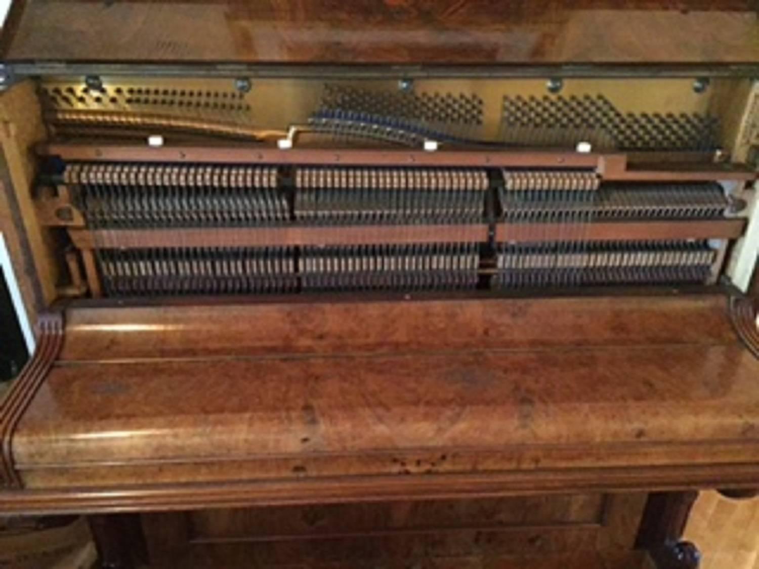 Unique upright piano H. Wolfframm with a metal plate made in Dresden Germany in the late 19th century. It is made of maple bird wood that has minor cosmetic damage on the lid.
When tuned the piano plays well and has a very nice tone and is