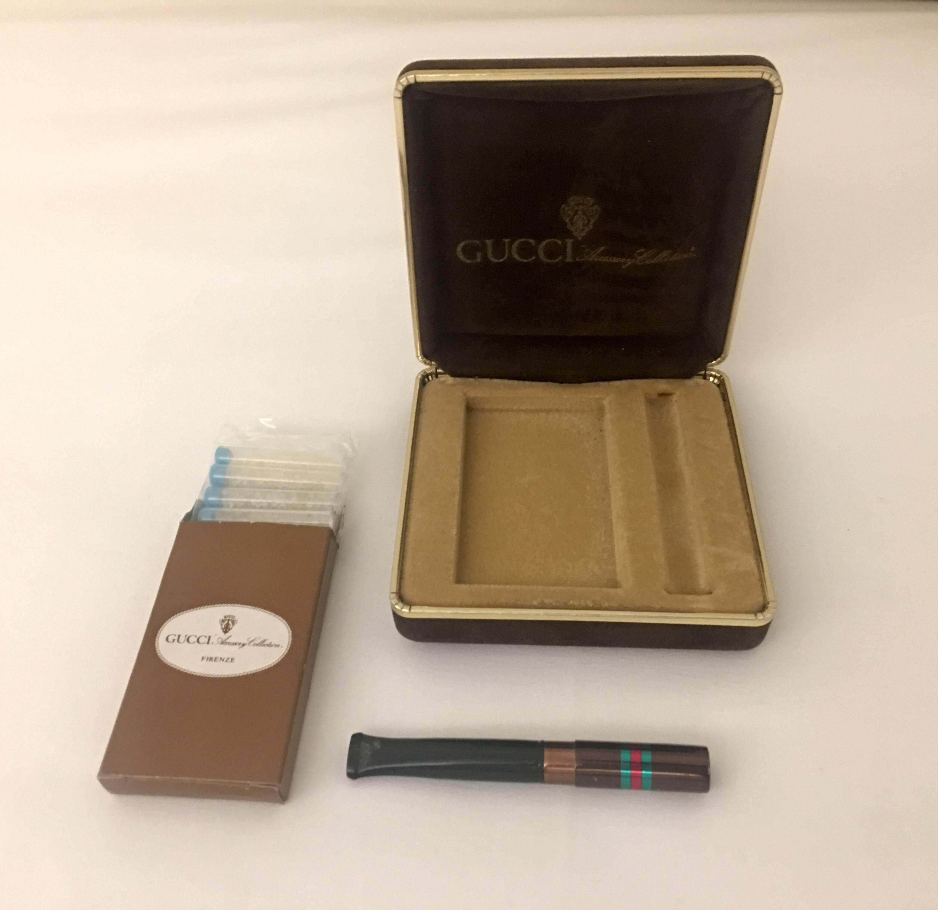 Gucci Accessory Luxury collection vintage cigarette holder with nine in the pack and original beautiful excellent condition brown Gucci box.
Very little visible sign of using the holder from the tooth.
Made in Italy.