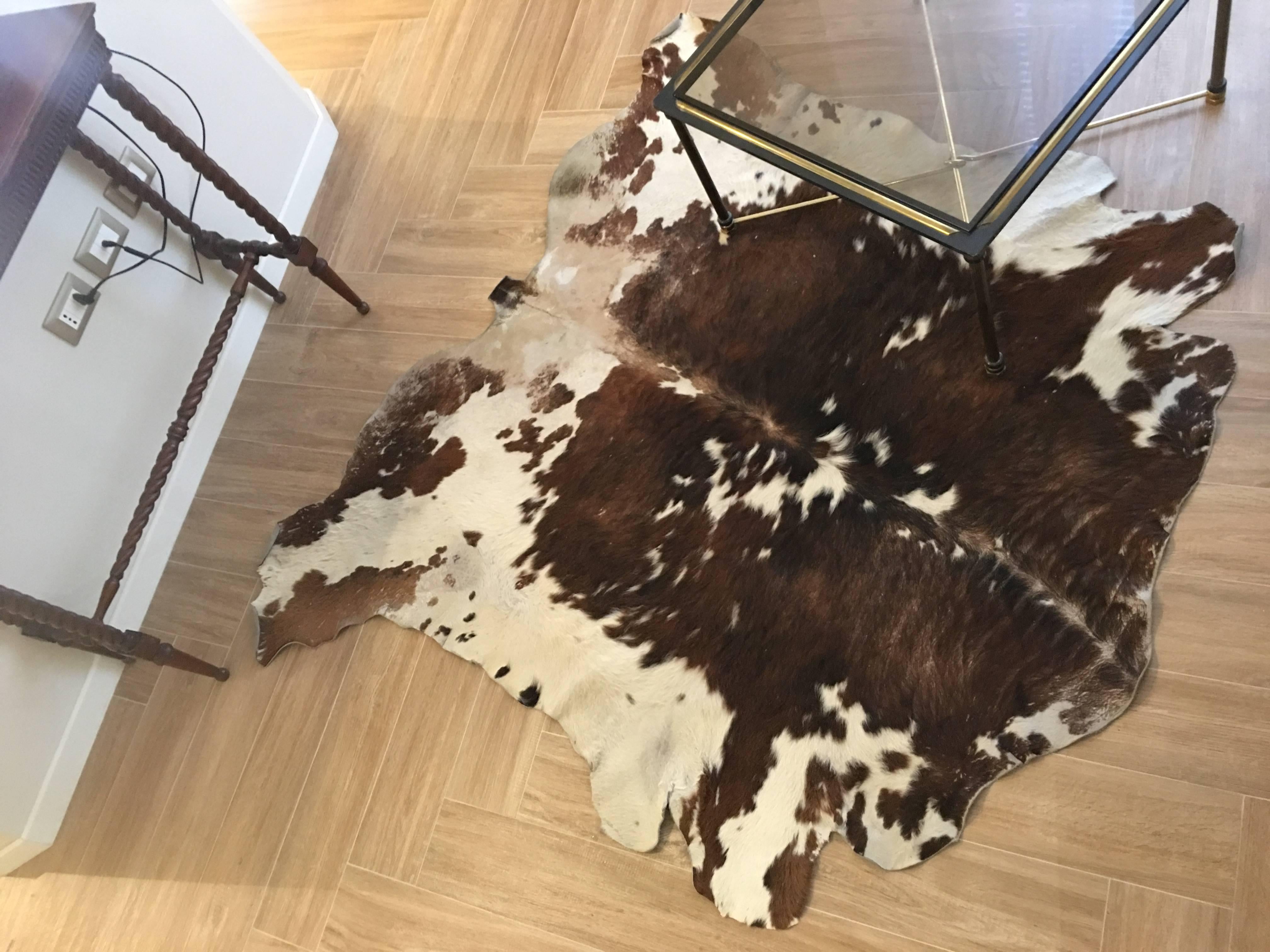cowhide rug on carpet