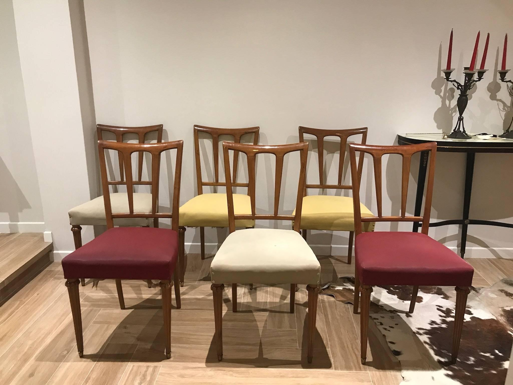 A set of six dining chairs, designed by Paolo Buffa.  The price is for all the set of six !

Base wood in oak, authentic upholstered in red, beige and yellow and original brass ends on the legs.

Quality and value! Beautiful Italian chairs.