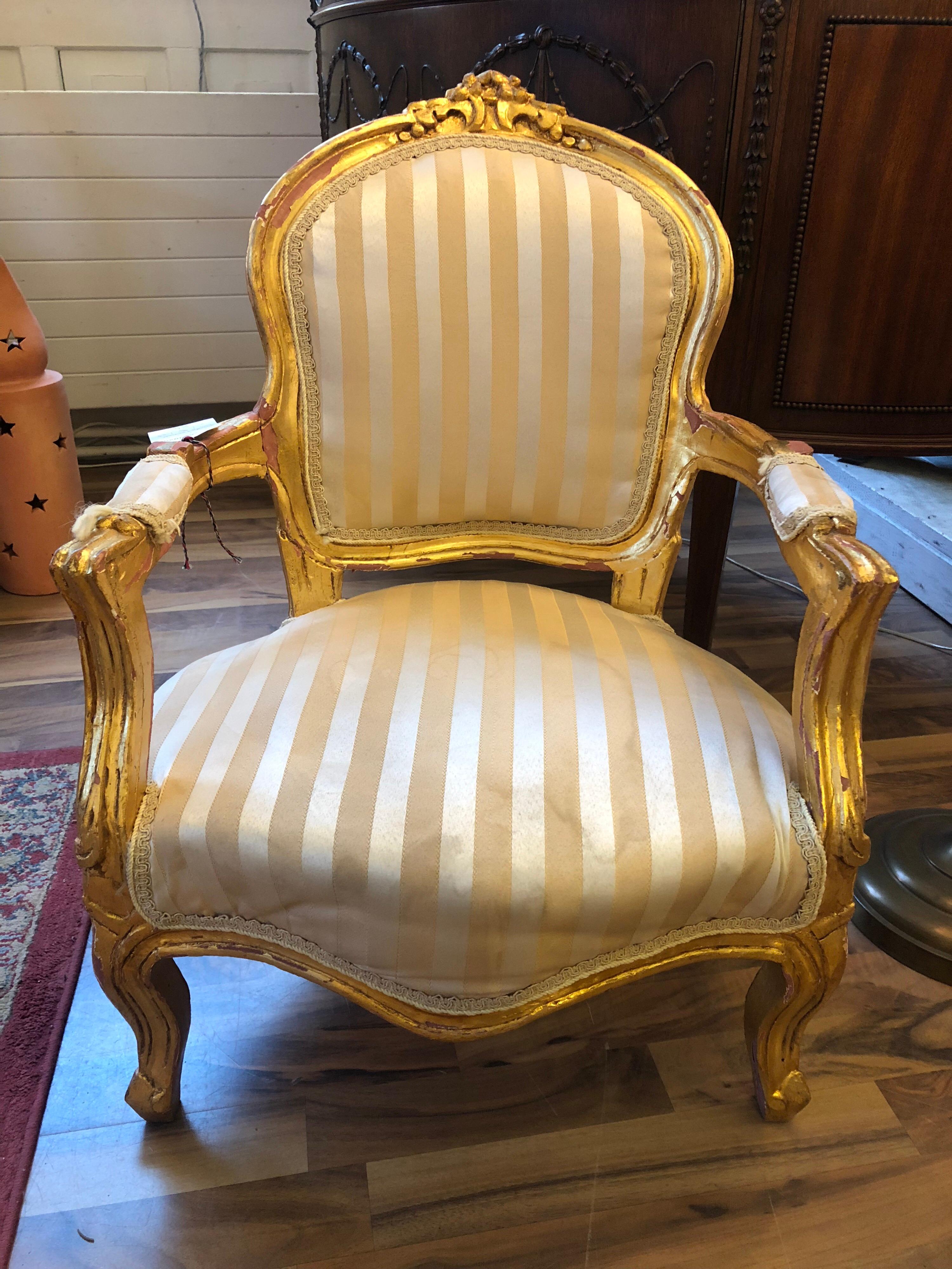 Low French giltwood armchair or side chair.





 
