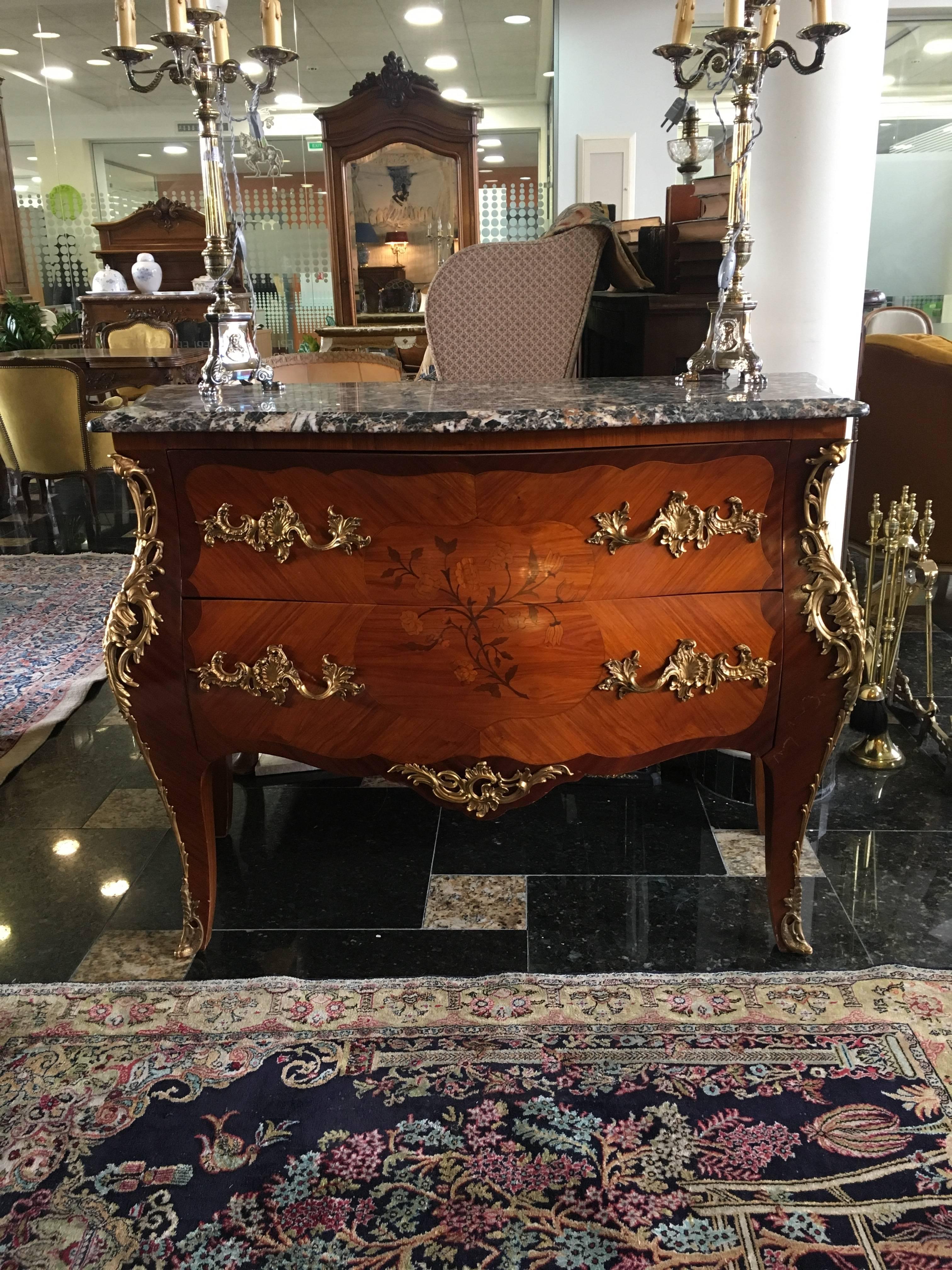 Magnificent 19th century marble-top two-drawer bombe commode from Paris, circa 1880. This commode is made from rosewood and features exquisite floral marquetry decoration and original bronze elements and handles. 
Excellent condition.
France.