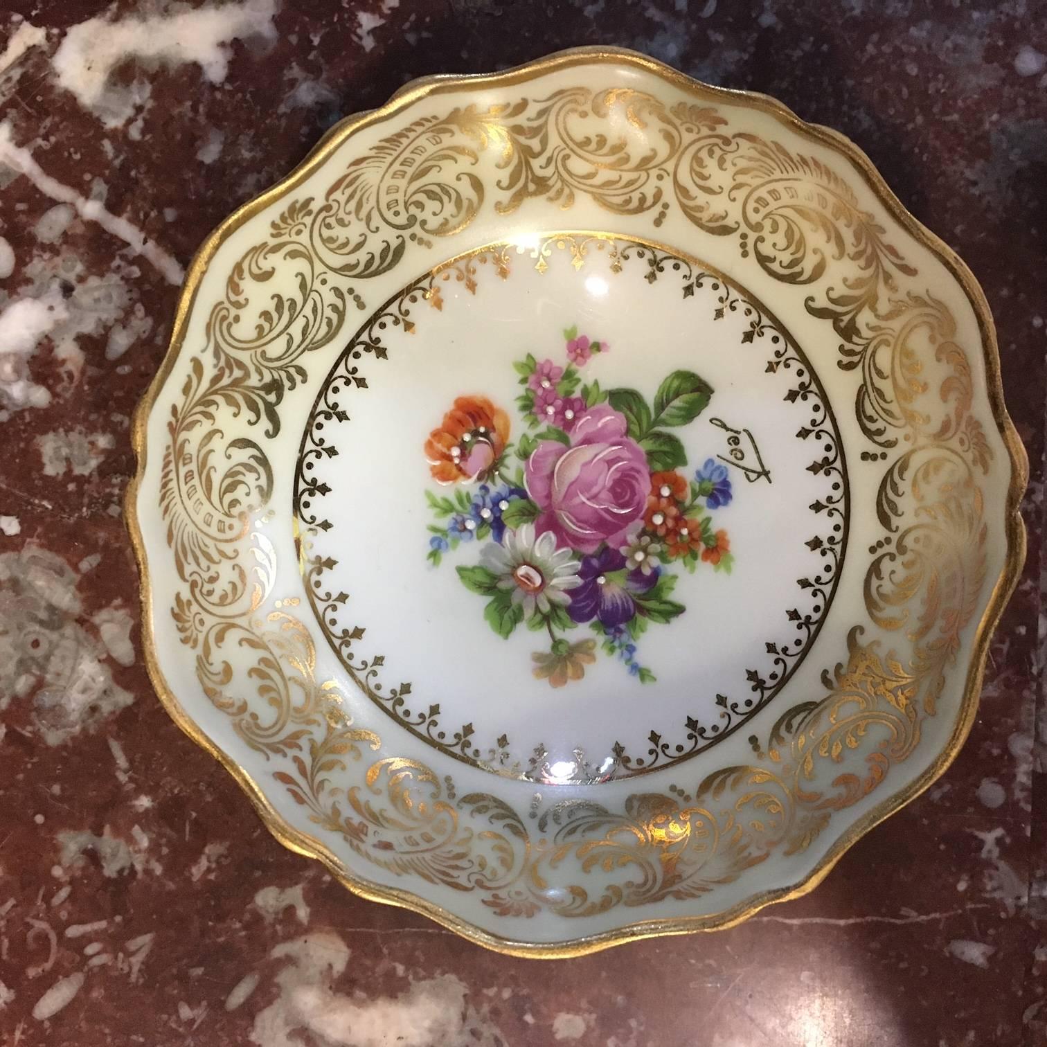 An unique and wonderful set of hand-painted desert bowls nine pieces. Double back stamped and factory decorated Jammet Seignolles Limoges Rehausse Main. Each variety hand-painted on the back of the bowl. These beautiful and rare set of nine bowls