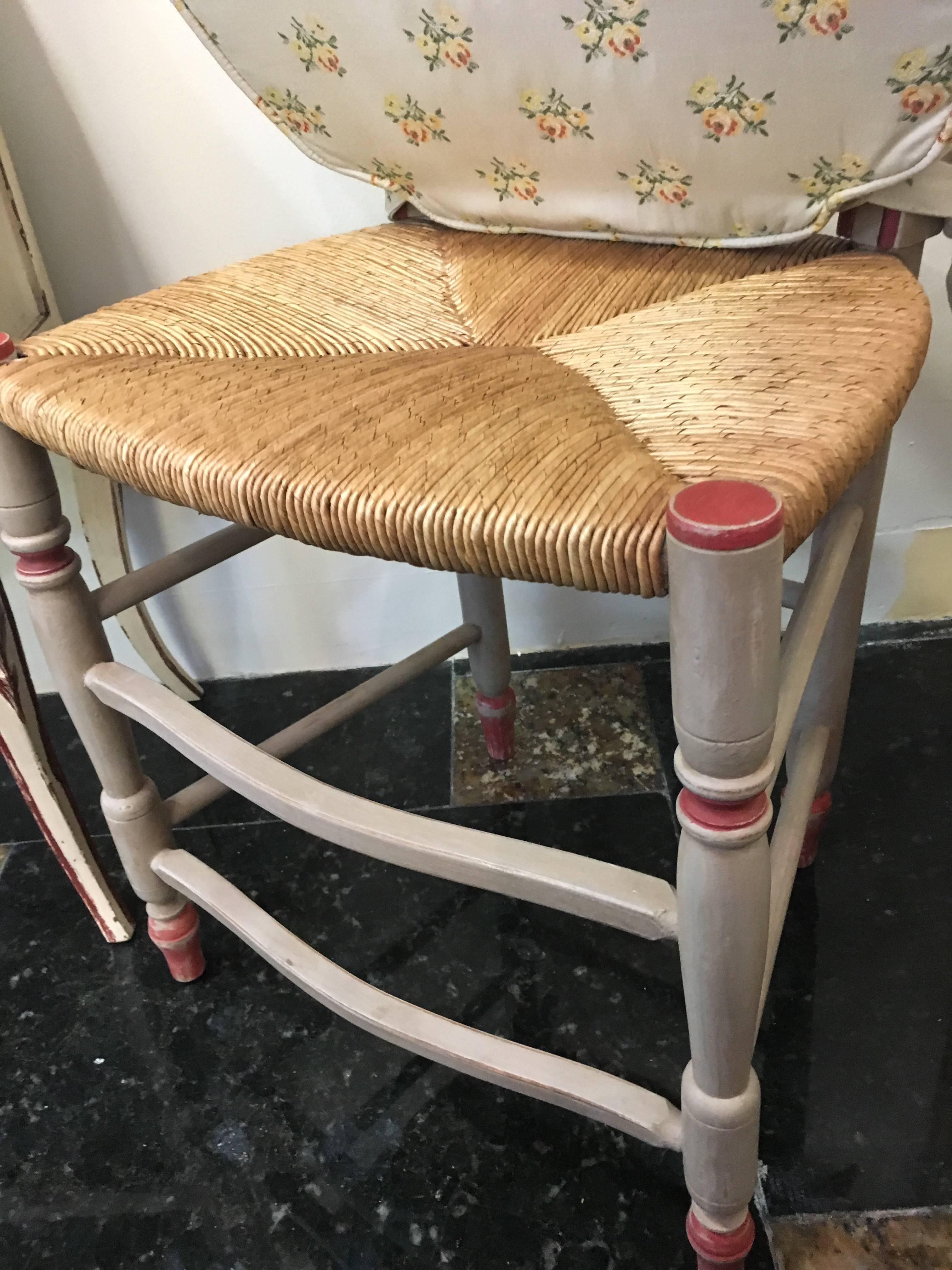 Set of six dining chairs from 19th century. Painted in light grey with coral accents, rush seats with nice cotton seating cushions covered with small colorful flowers.
All in perfect condition.