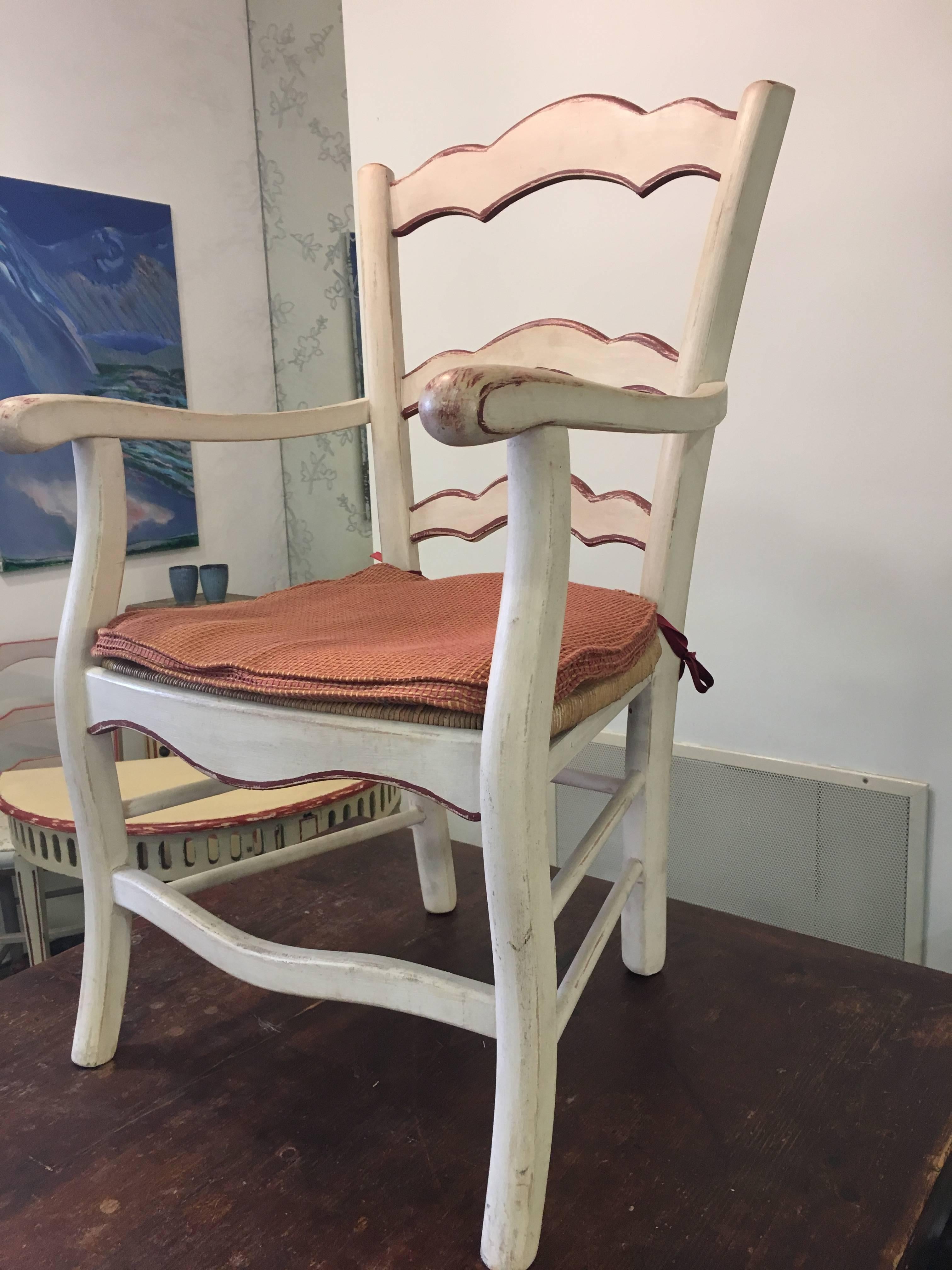 One dining chair from 19th century. Made of solid wood, painted in light beige with coral accents, rush seats with nice linen seating cushion in very good condition.