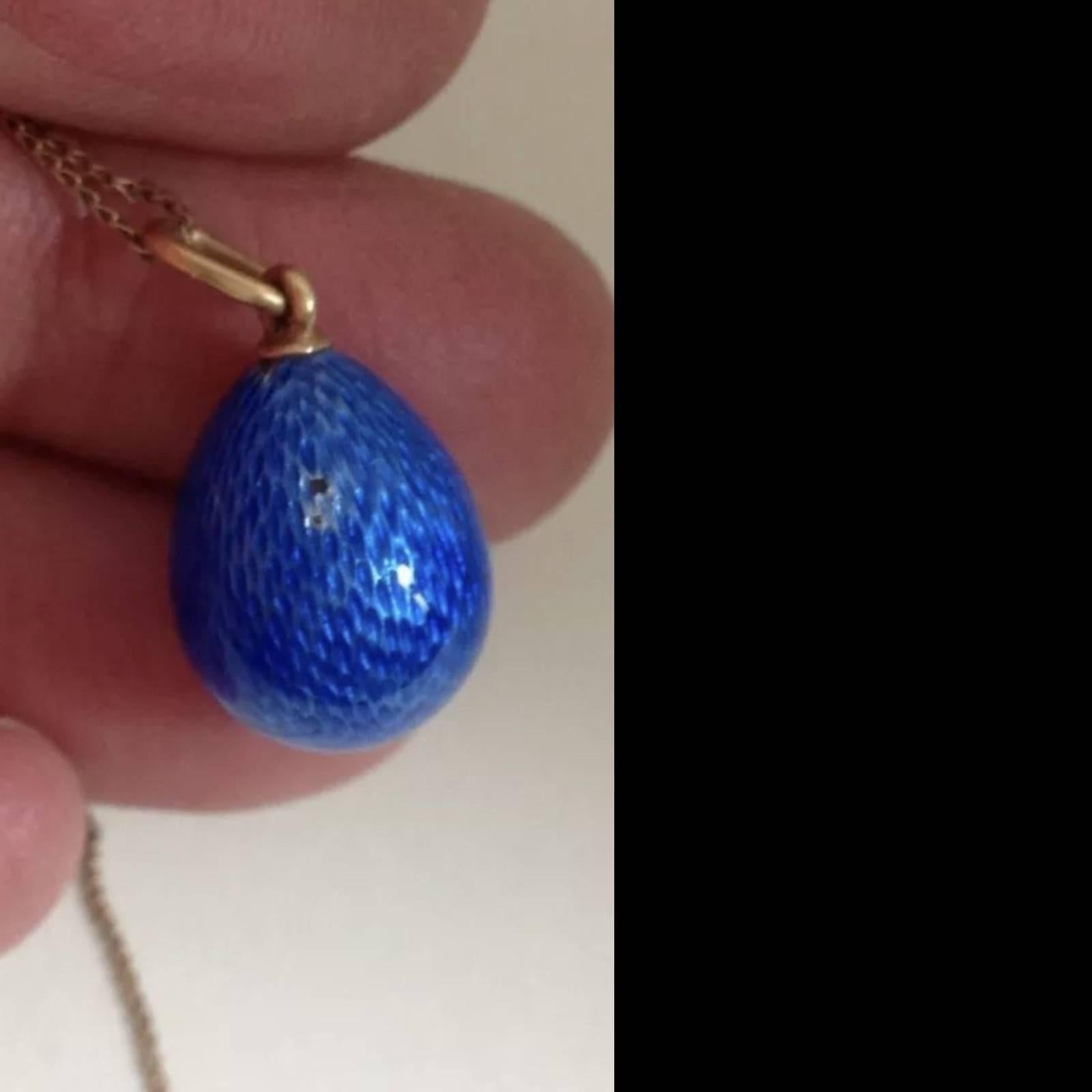 Rare Faberge Erik Kollin Guilloche Russian Imperial egg

You are looking at a beautiful guilloche enameled pendant. 
It has the 56 Russian gold marks and what looks to be the workmaster mark EK - workmaster Erik Kollin, ST Petersburg, circa 1885,