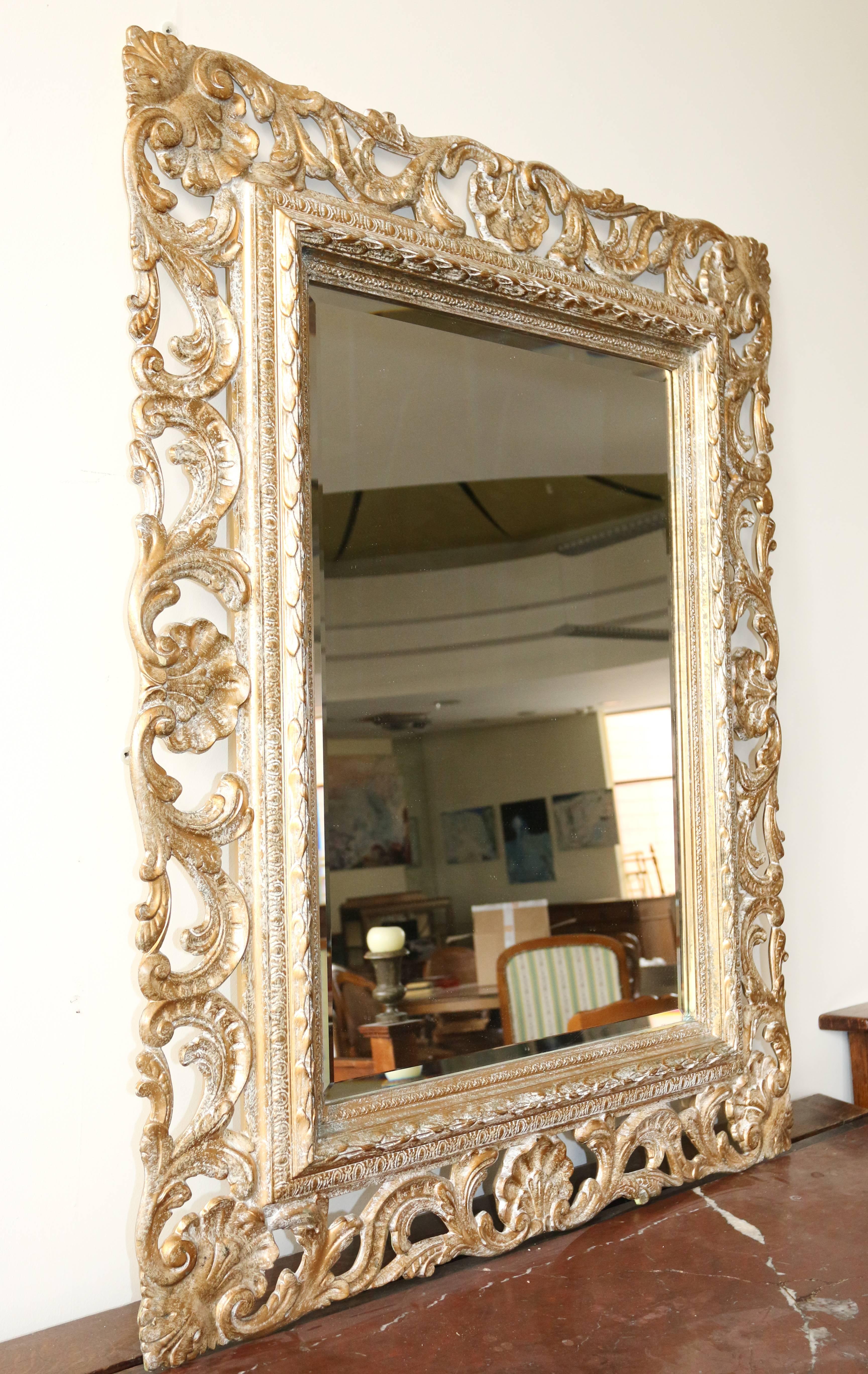 Receive our new selections direct from 1stdibs by email each week. Please click follow dealer below and see them first!

This giltwood Florentine mirror originates from Italy, dating back, circa 1930. The entire frame is decorated with a plant