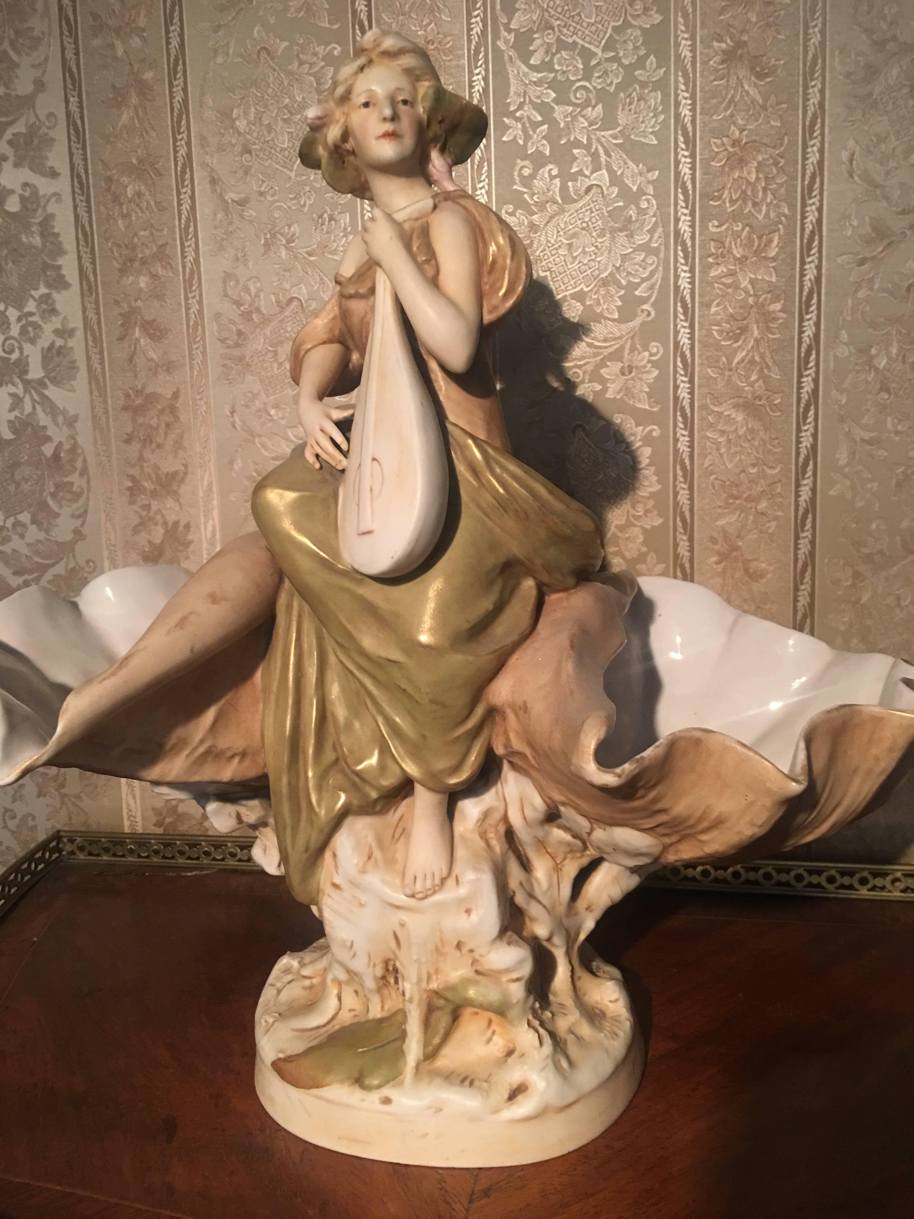 Beautiful large Art Nouveau porcelain figure Royal DUX

Royal Dux is a porcelain company based in the Czech Republic that manufactures figurines and ceramics in Neoclassical and Art Nouveau styles. Some of their most popular pieces include the