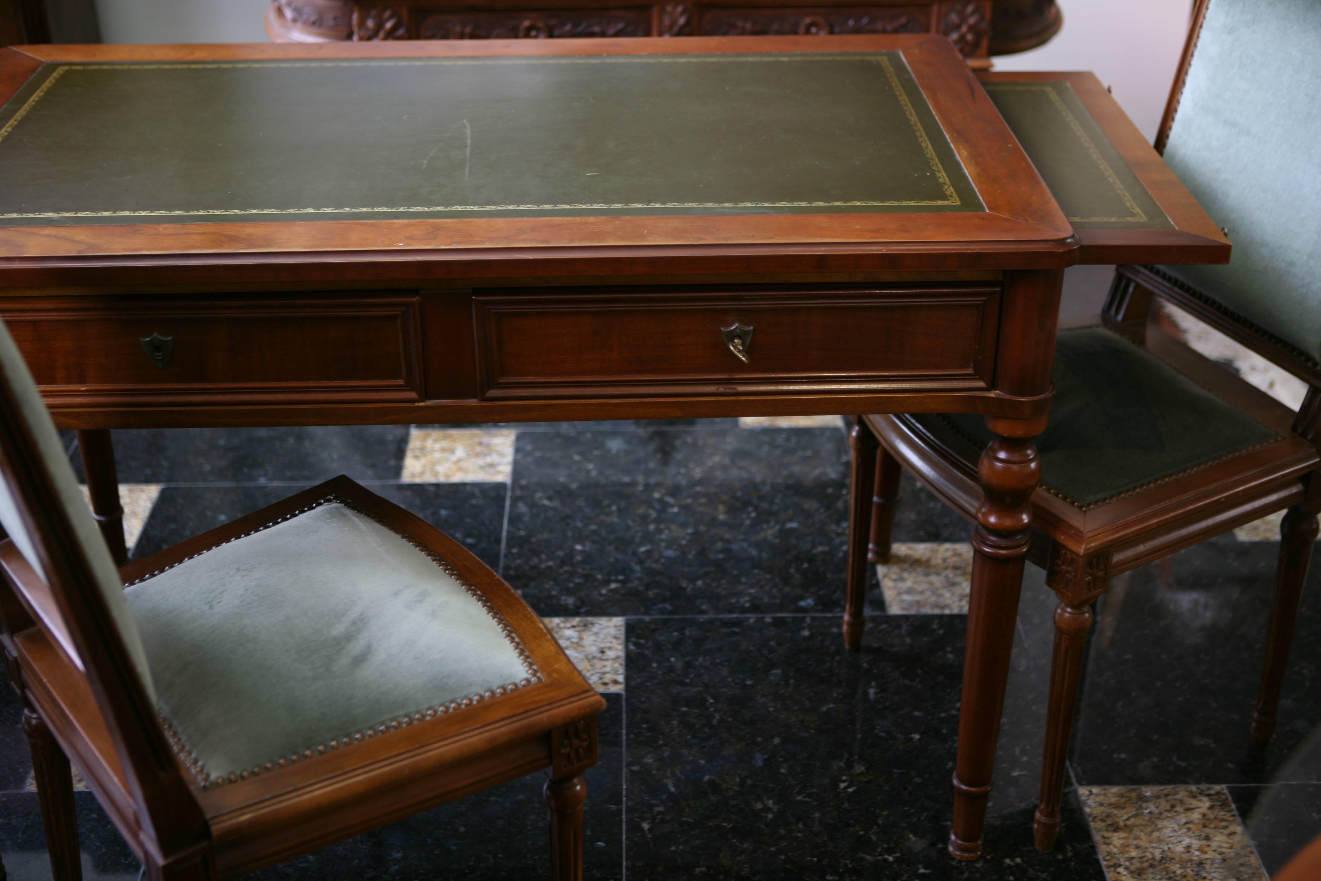 French Louis XVI style mahogany bureau plat or writing table with dark green embossed leather top, two slides, two drawers and straight legs.
circa 1880.
  