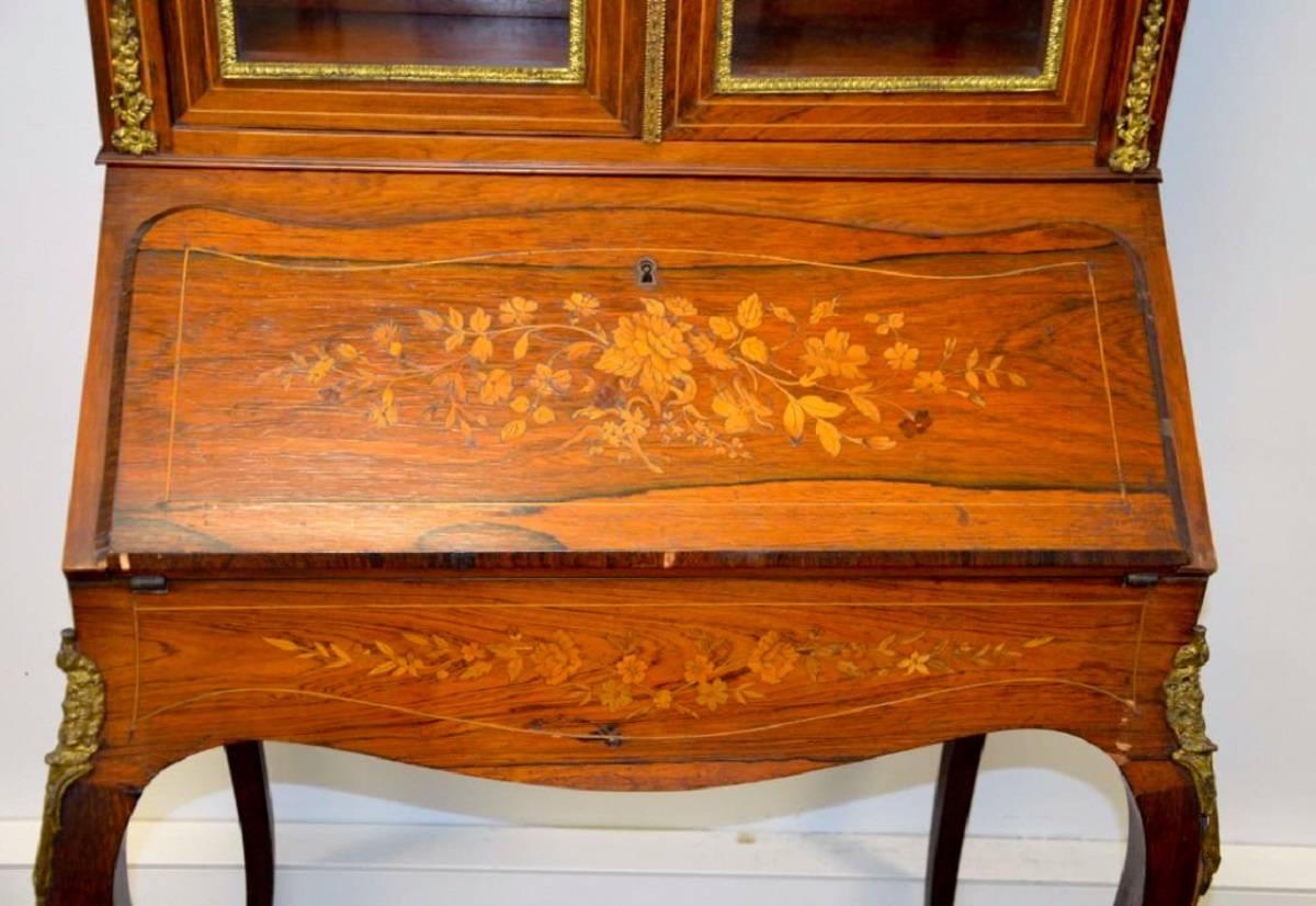 19th century French rosewood and marquetry Bureau de Dame in Napoleon III style.
The bureau stands on slender cabriole legs and has a beautiful upper part.
This desk has large panels of inlay work to the fronts and sides.
France, circa 1870.
 