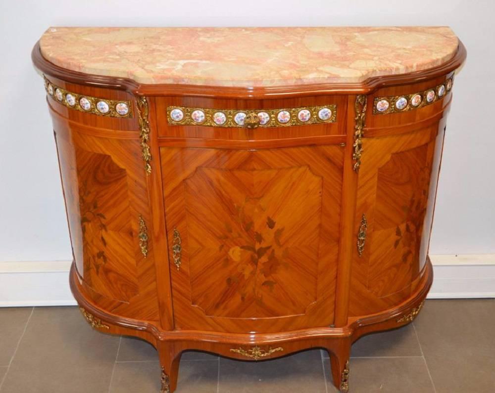 A nice late 19th century gilt bronze-mounted wood Louis XVI style cabinet.
It has demilune shaped rose marble top above and is decorated with small porcelain round pieces,
France, circa 1870.
 
