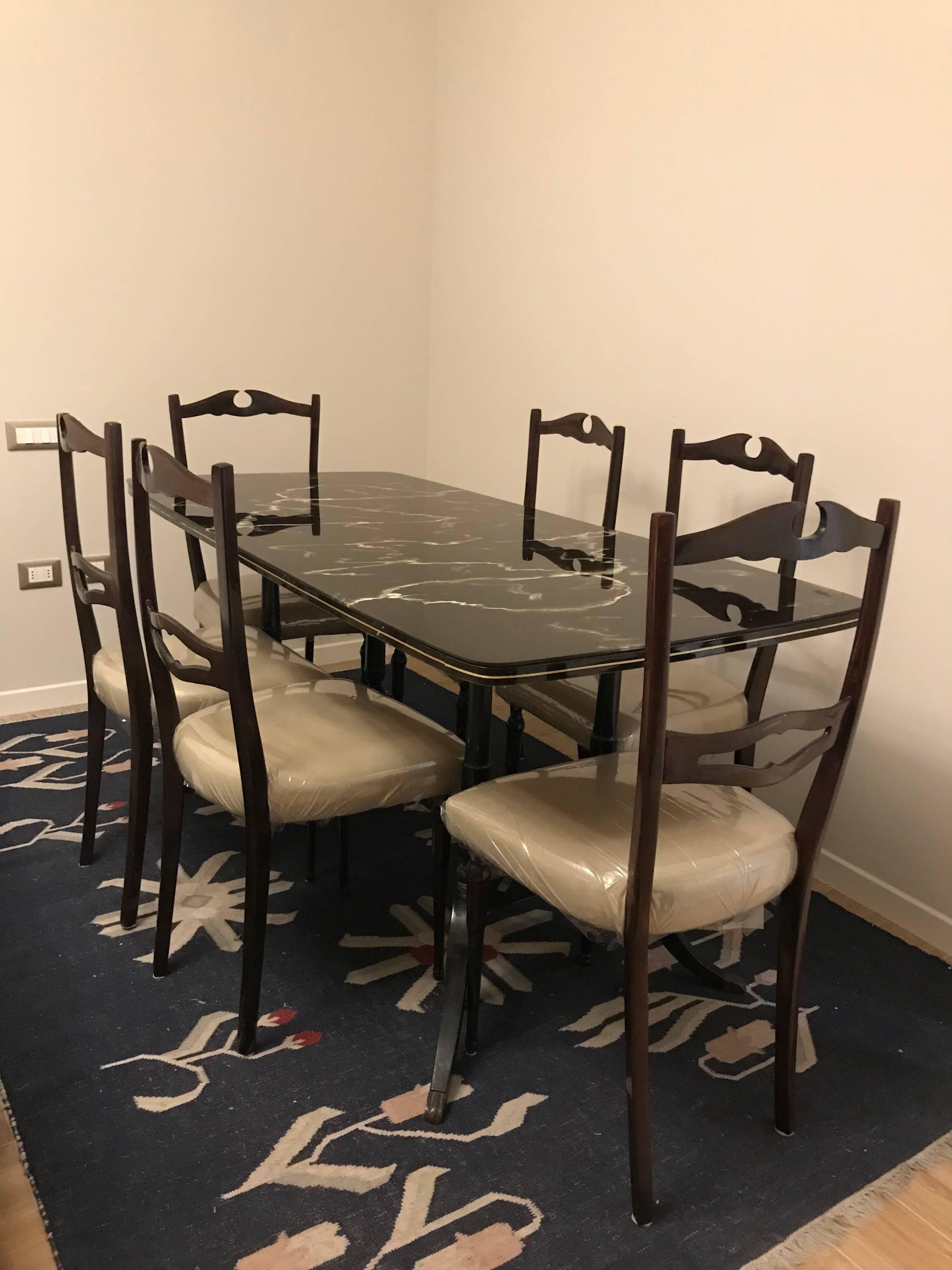 Amazing Mid-Century Modern dining room set consisting of a large table with a beautiful glass top and six chairs in ultimate condition!

Table measurements : 167 cm W, 77 cm D, 78 cm H

Chair measurements: 98 cm H, 43 cm W, 42 cm D, 46 cm seat