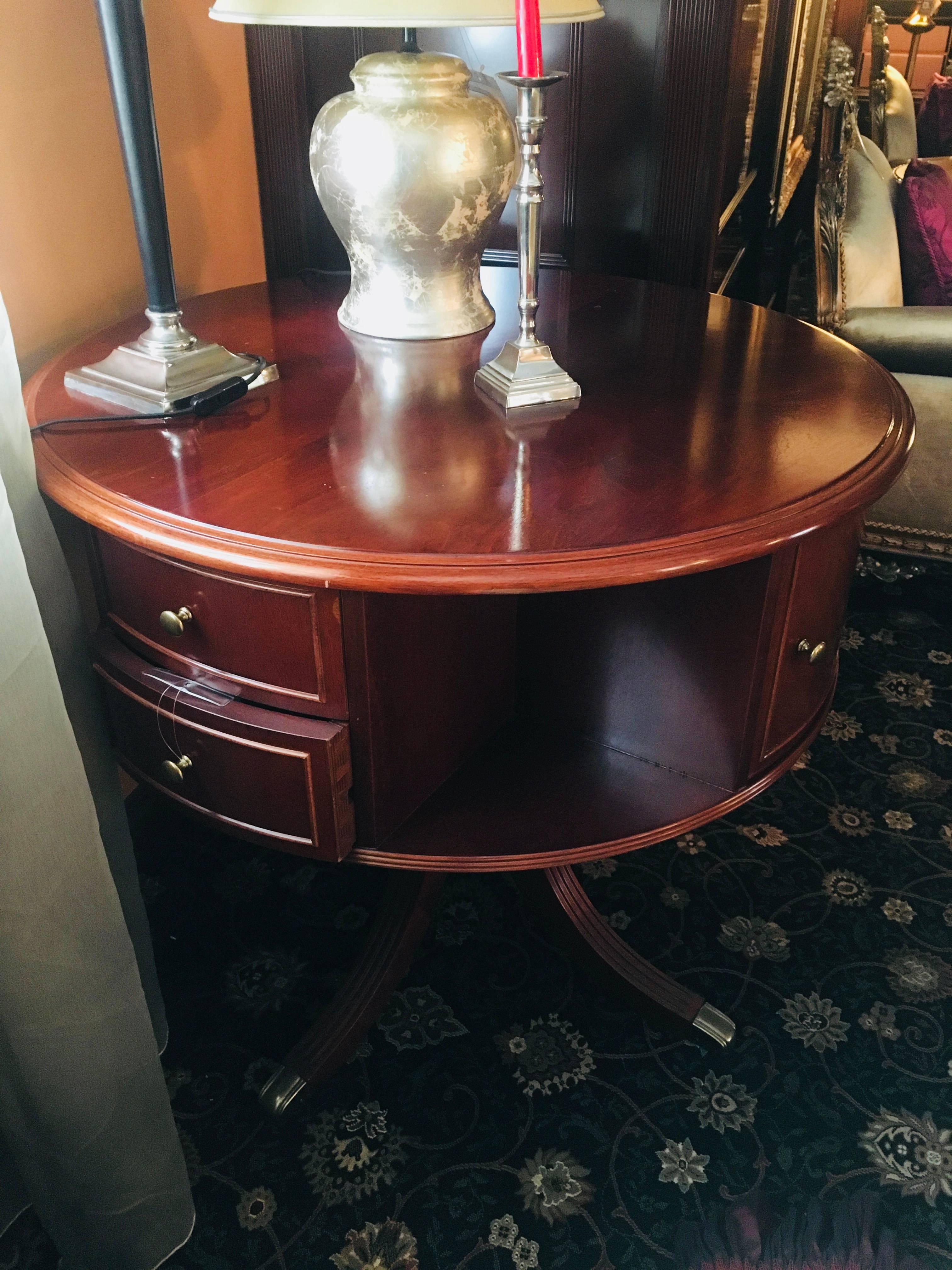 20th Century mahogany bar table resting on carved leg separated in four directions ending with brass boots.
Italy, circa 1990 