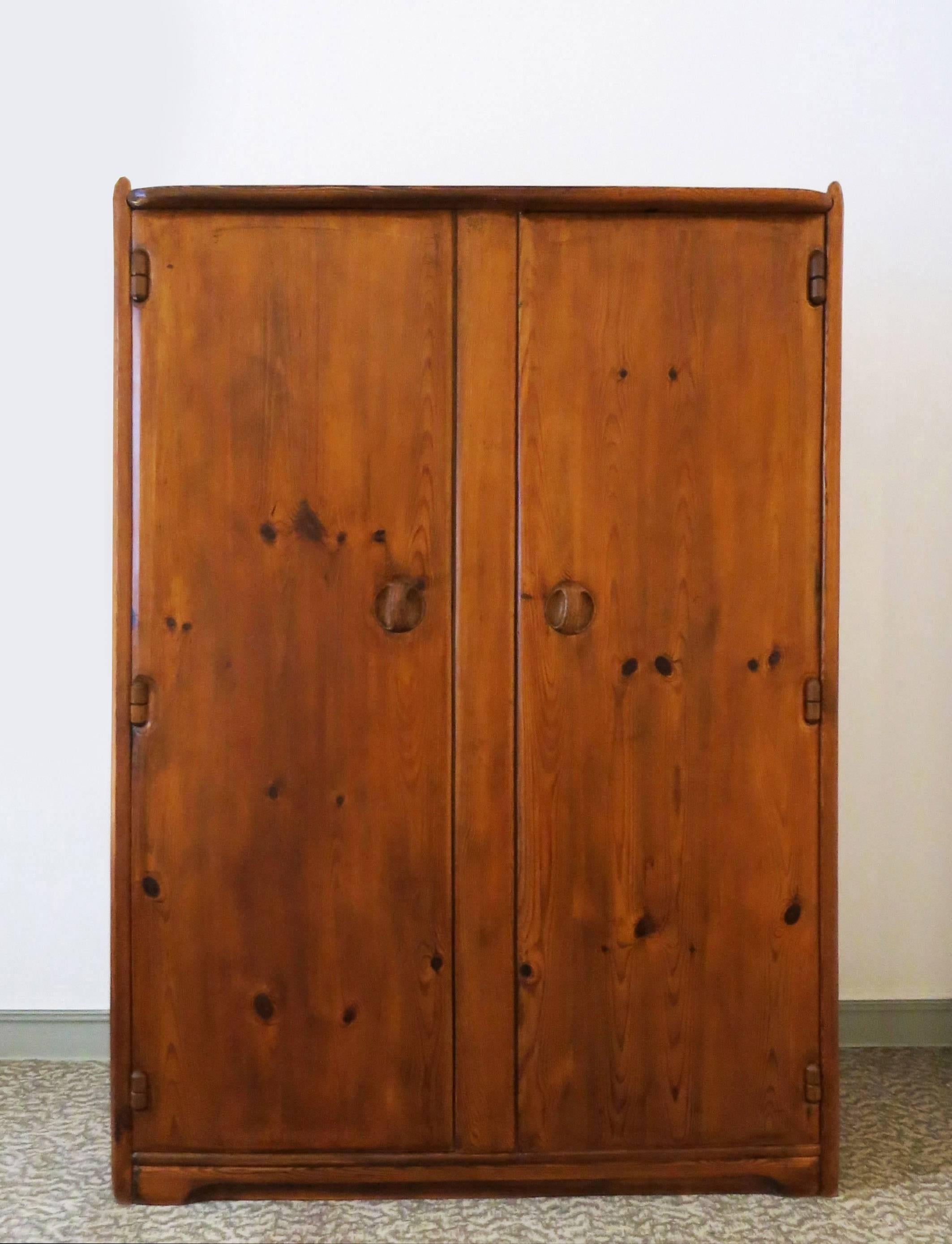 A beautiful wardrobe by Swiss cabinet-maker Franz Xaver Sproll in the 1940s.
Handmade by Sproll, with rounded carved edges. Handles, hinges and locks are also made in wood.
Interior shelves and hangers rod.