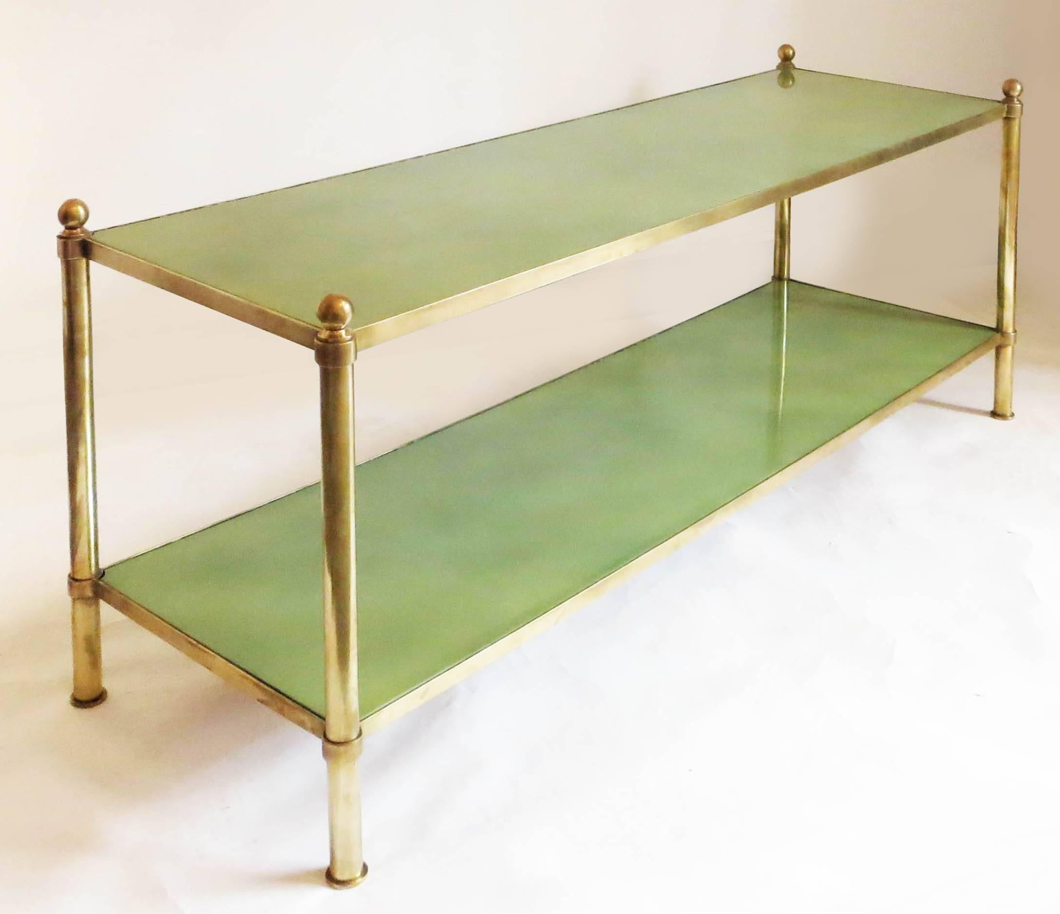Rare André Arbus coffee table from the 1950s.
Structure in gilded brass with two fantastic green cloudy lacquered tops.