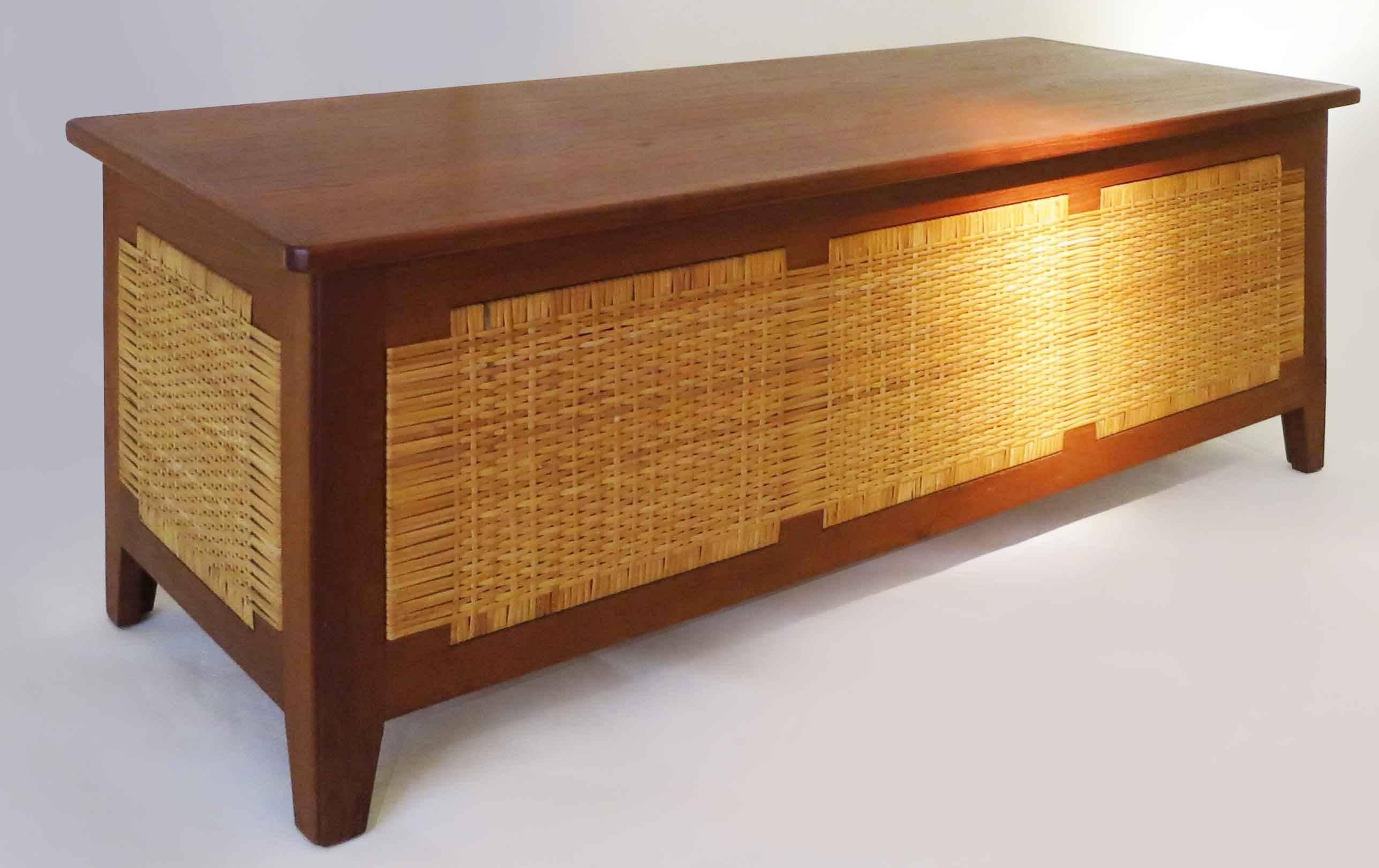 Long chest bench by Kaj Winding, Denmark, 1960s
Solid teak with cane panels on four sides.
Opening top.