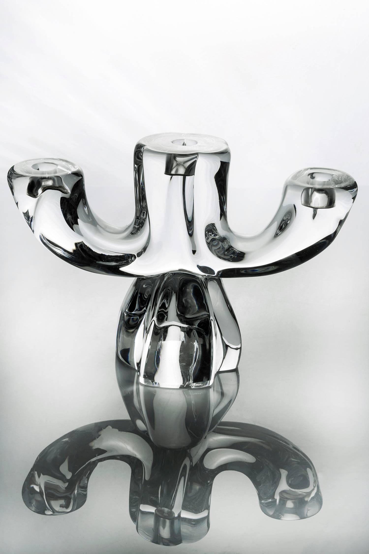 One beautiful three-armed candelabra. Crystal and substantial in weight, circa 1950 and in excellent vintage condition. Signed Daum, France, the Cross Lorraine in the centre.