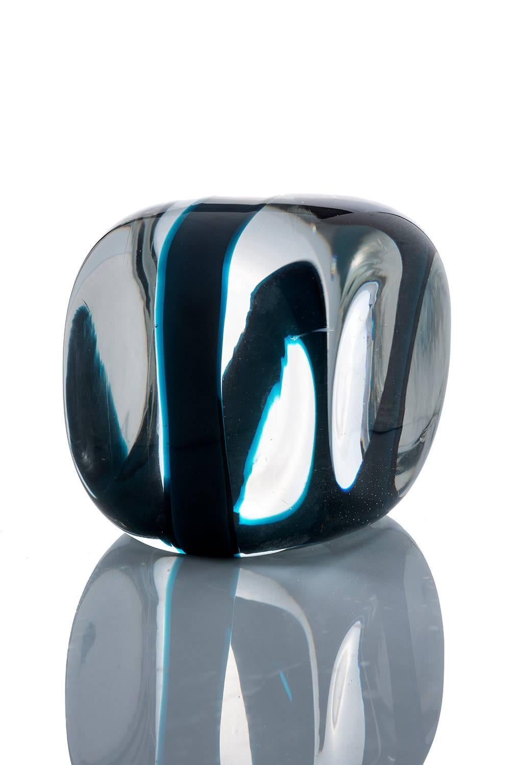 Elegant glass paperweight designed by Pierre Cardin for Venini, circa 1968.
Clear glass with a striking blue detail. Substantial in weight and size, measuring 12.5cm all ways.