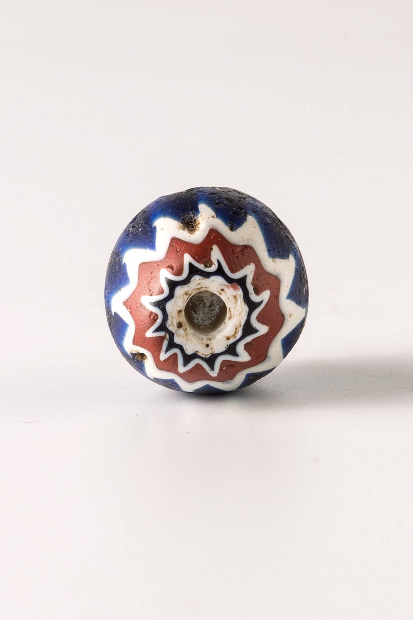 Beautiful large six layered multicoloured “Rosetta” Chevron bead, in cobalt blue, red and white in a twelve star pattern.
Venetian, c. 16th-17th century
In excellent condition.
Provenance: Private Swiss collection since 1970.	
Accompanied by a
