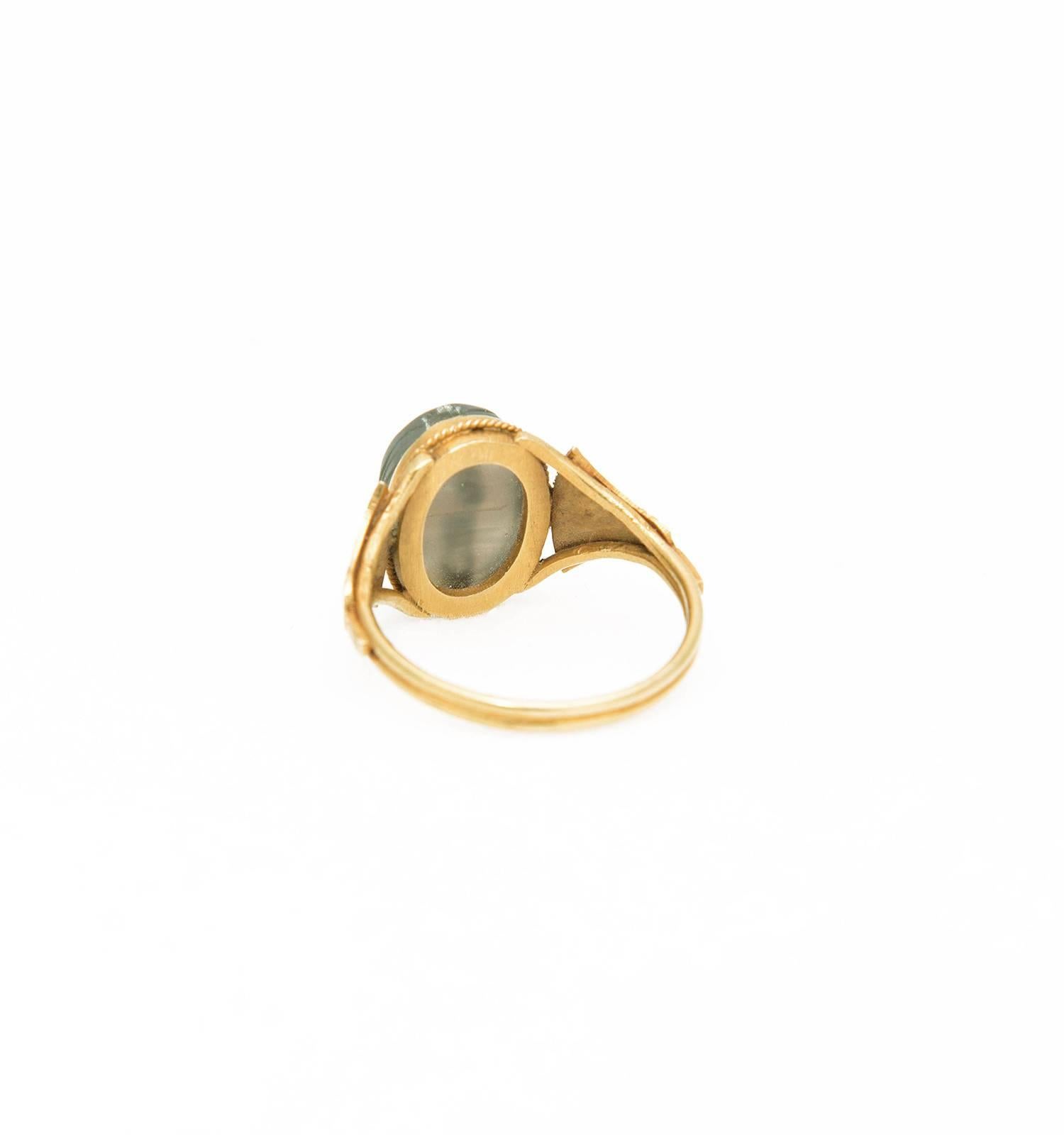 This delicate finger ring is wearable and remains in an excellent state of preservation.
The lotus motif carved gold ring has an ancient translucent amethyst scarab, drilled lengthwise from two sides.
Provenance: Private English