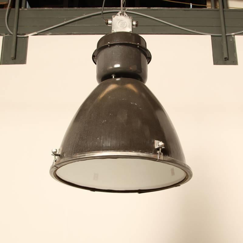 Type II linz G Industrial light with glass

dark brown-grey enamel, almost black

inside white enamel

We have replaced the fitting with a standard E27, so you don’t have to go searching for odd bulbs.

dimensions: 56 D x 56 W x 77 H cm.