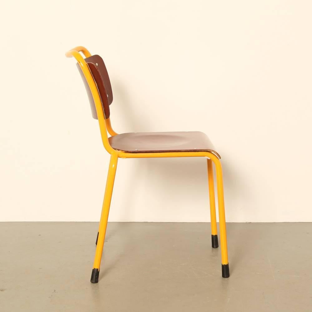 Name: 1252
Designer: design-office, Gispen
Manufacturer: Gispen, the Netherlands
Design year: 1964

Tube-metal frame, over painted orange, veneered beech seat and back

We purchased these from a military depot, hence the