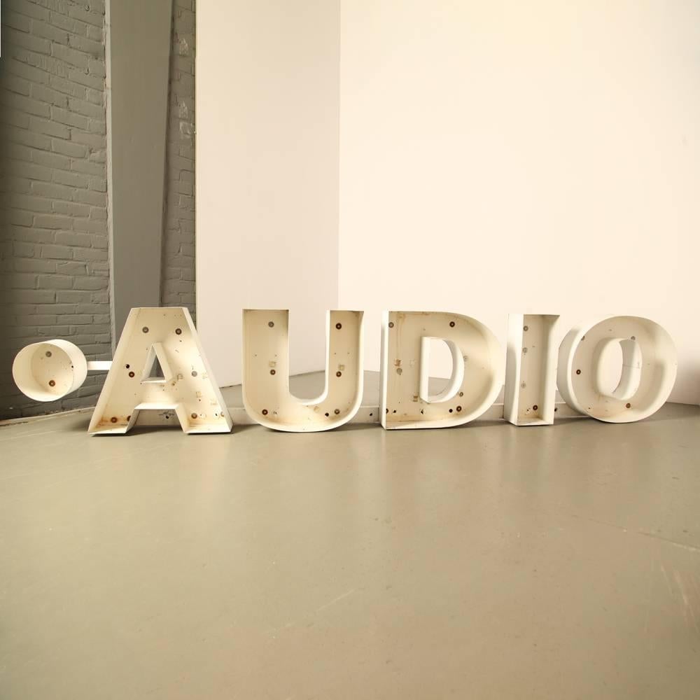 “Audio” advertising letters

Sign, billboard or nameplate

Light-box letters (from which lights etc. have been removed)

Bent and folded sheet metal

1960s.



         