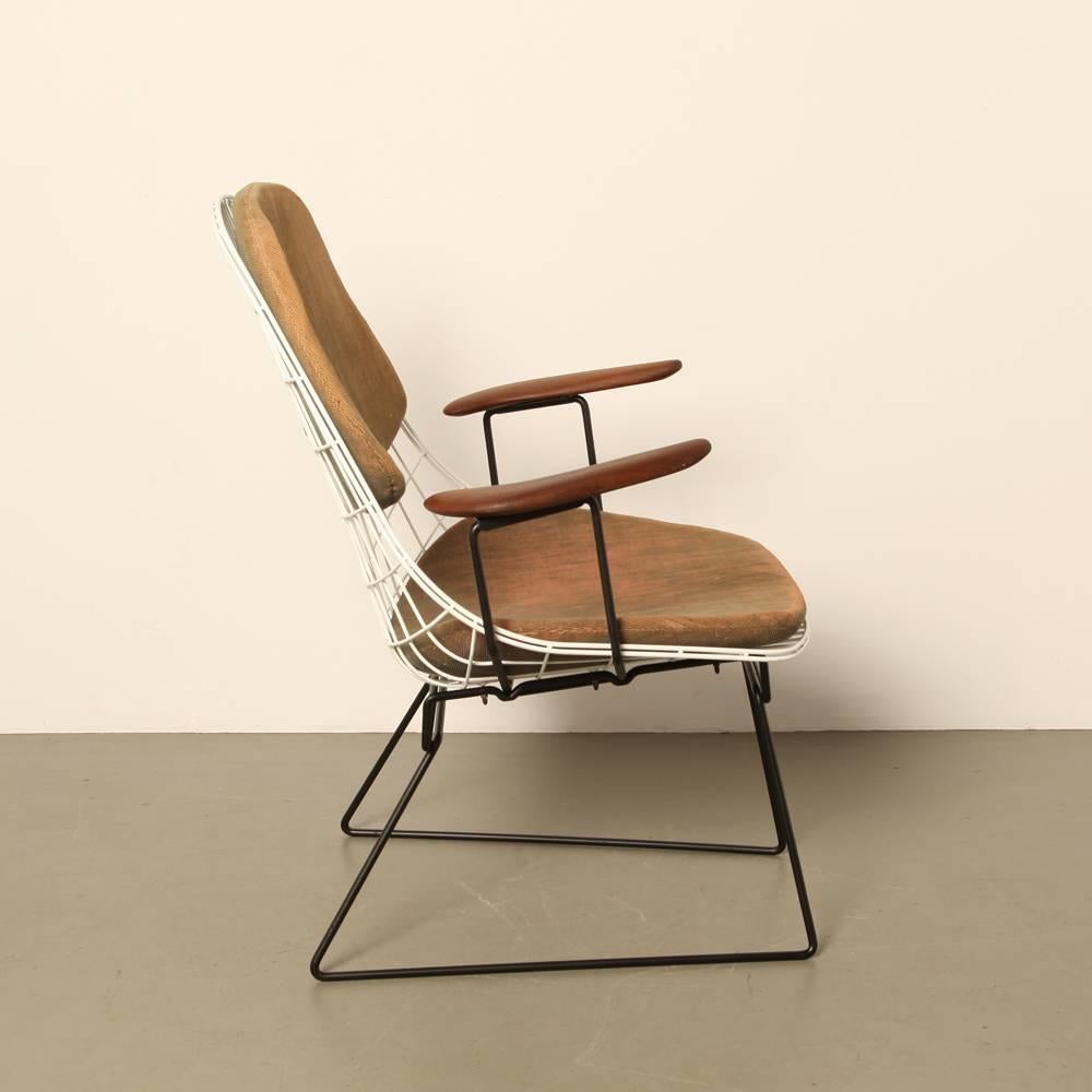 name: FM06 wire lounge chair
designer: Cees Braakman met Ad Dekker
manufacturer: Pastoe, the Netherlands
design year: 1958

Completely original, from 1958. The seat cushions are worn, faded, and filled with horse hair; but because they’re