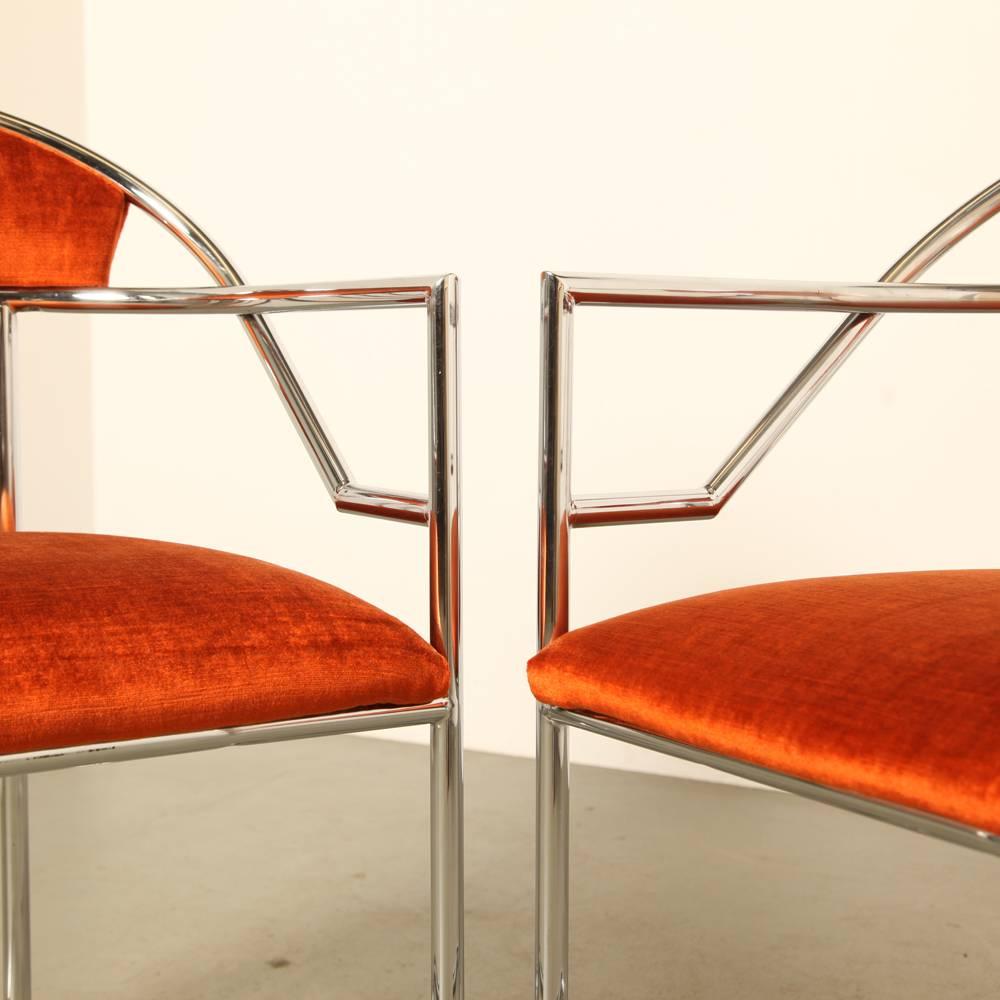 We can’t trace these chairs, therefore in the style of.

They have been beautifully polished and newly upholstered in a rust-orange-red velour, a very nice effect together!