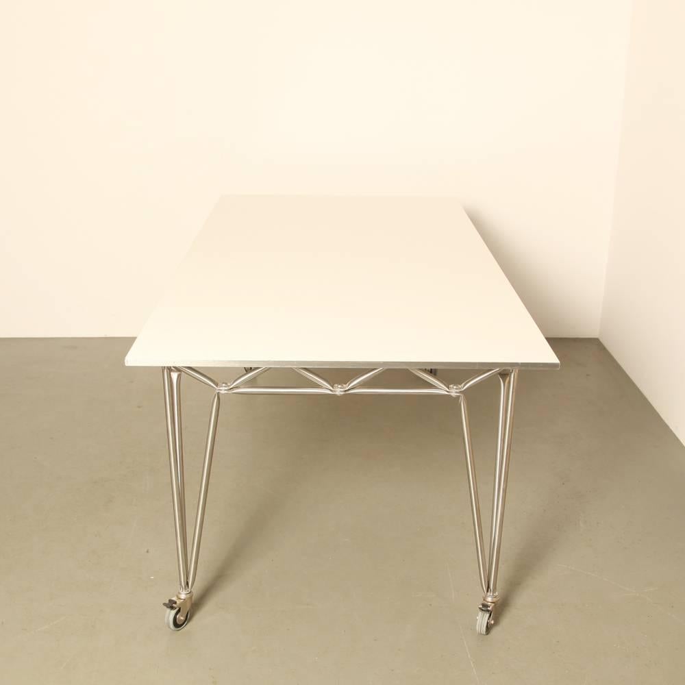 Name: Bridge M
designer: Dirk Uptmoor, Jürg Steiner
manufacturer: System 180, Berlin, Germany
design year: 1980

The frame of the Bridge table is made of mat chromed steel, the tabletop is made of white MDF.
The legs are in excellent