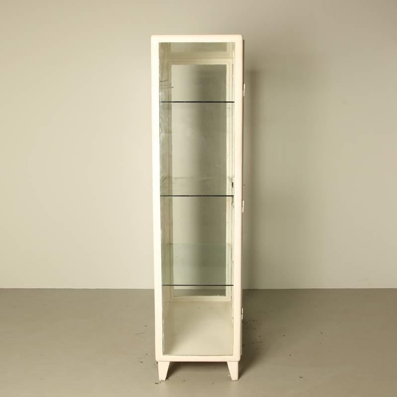 White sprayed steel doctor’s apothecary cabinet,
coming from Poland. Manufactured: 1950s
Glass is renewed, two doors, with key.


     