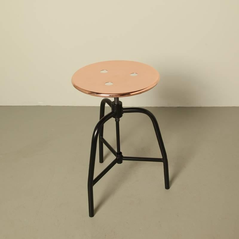 Industrial looking copper top stool. Inspired by an old polish doctors stool.
Turn able, adjustable in height. Measure: Seat height 45-55 cm
Black sprayed steel frame, copper top (self designed).