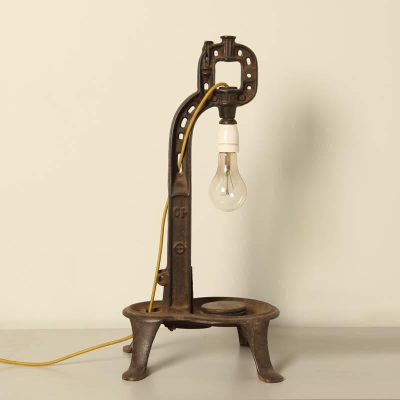 Selfdesigned Industrial French table lamp. 
Cast iron element, mustard colored fabric cable. 
Normal E 27 porcelain lampholder. 
Unique piece, only one.
(Carbon wire lamp not included)

All lamps have been made suitable by international