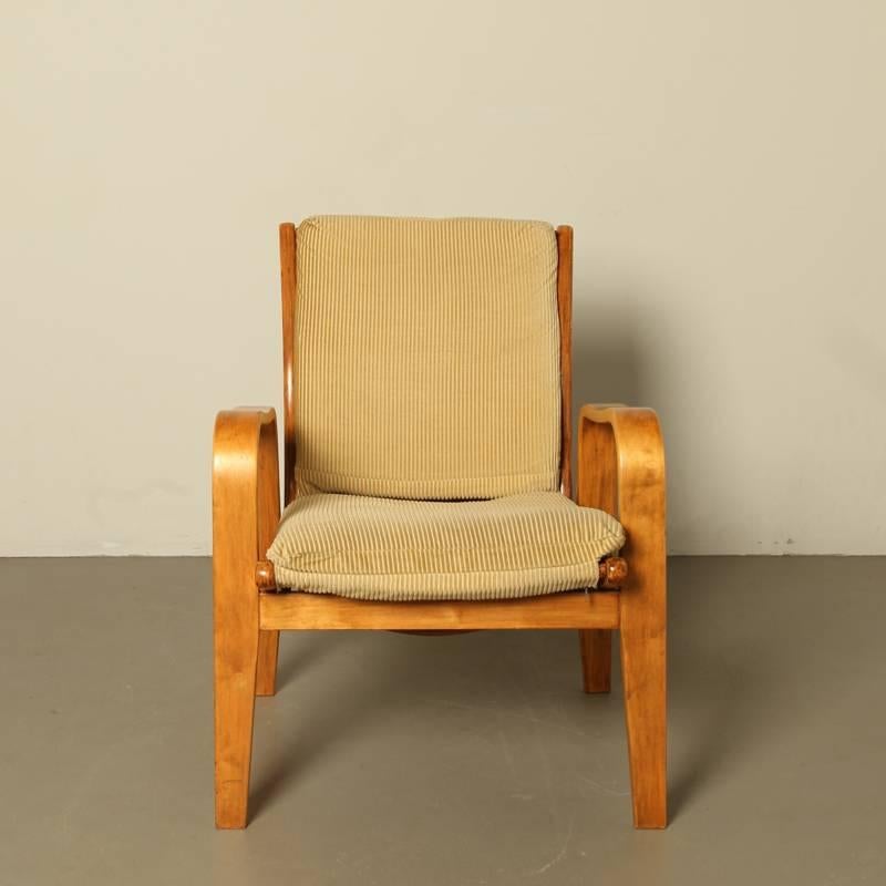 Designer: Cees Braakman, the Netherlands
Pastoe, the Netherlands, year 1952
Material: steamed bended birch wood, yellow corduroy upholstery
with spiral springs in the back and seat.