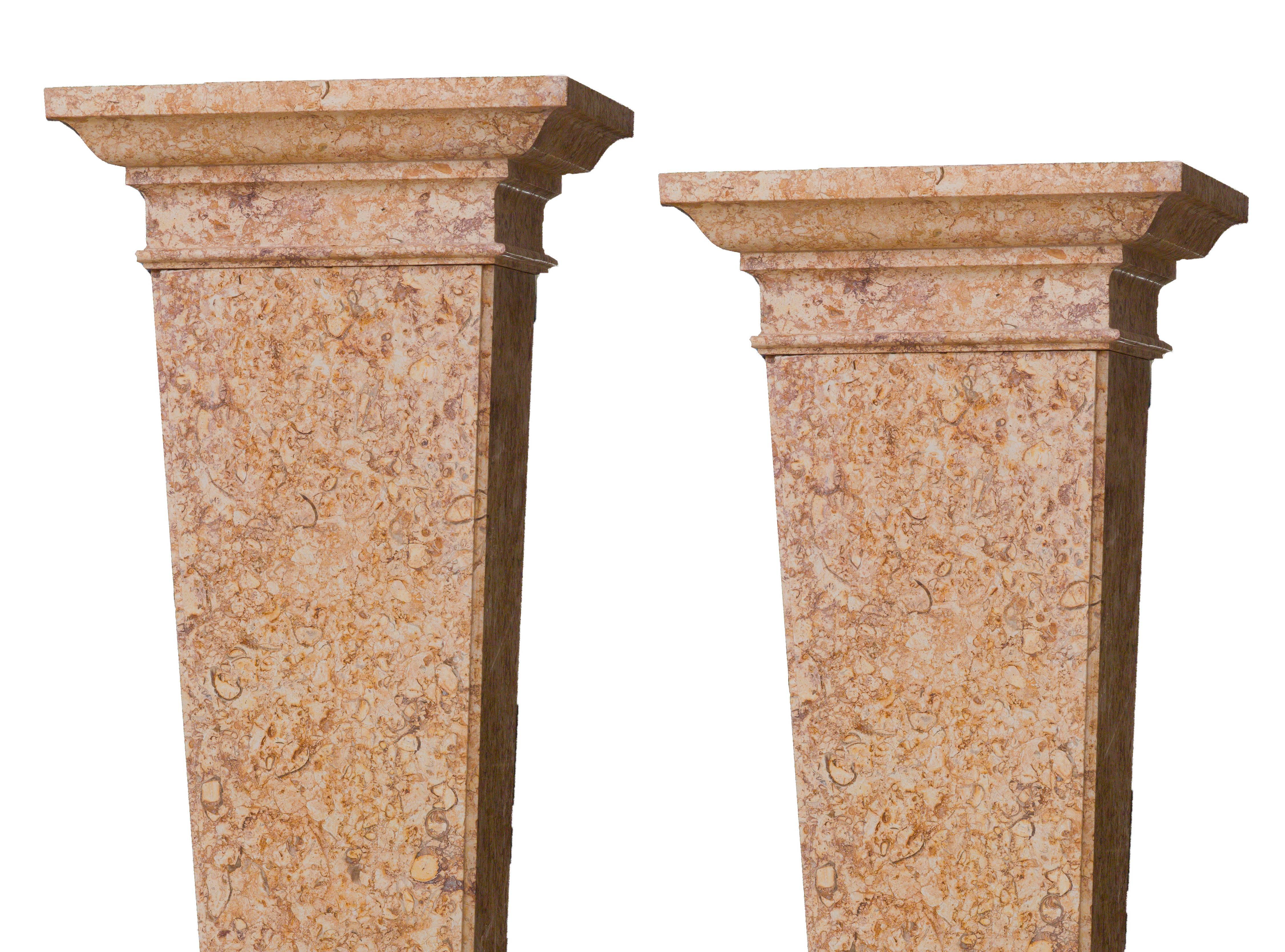 An impressive pair of pedestals made in marble, a warm and a precious broccatello di Spagna. The line and the edges of these two architectural and ornamental pieces are pure and equilibrated to represent a classical of the high level decoration.