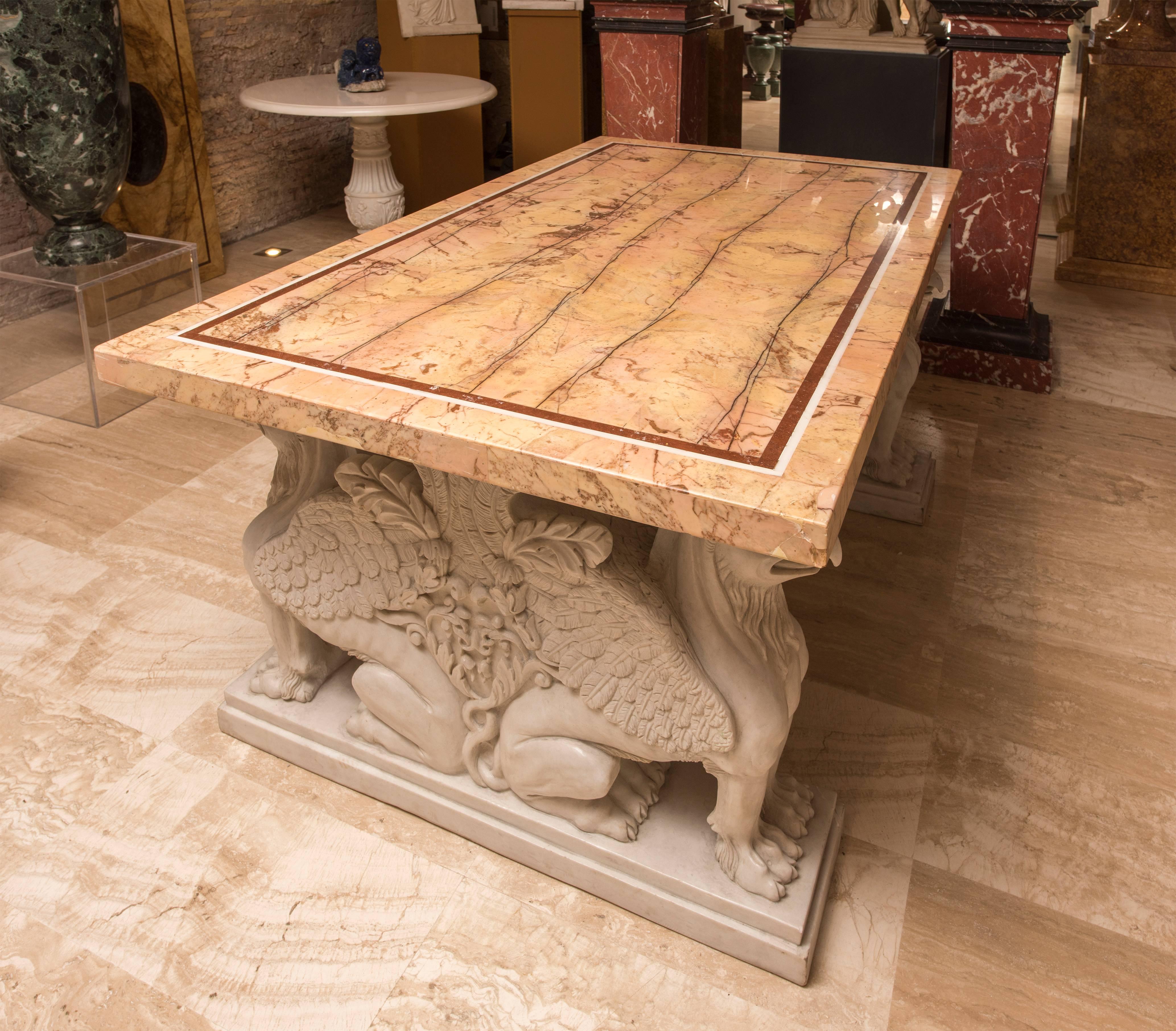 This specimen table is made with rare and ancient marble on neoclassical style legs made in white statuary marble. The top is a matching of Giallo Antico Marble bordered in a Porfido Rosso and Bianco Antico Frame. The top is made cutting very thin