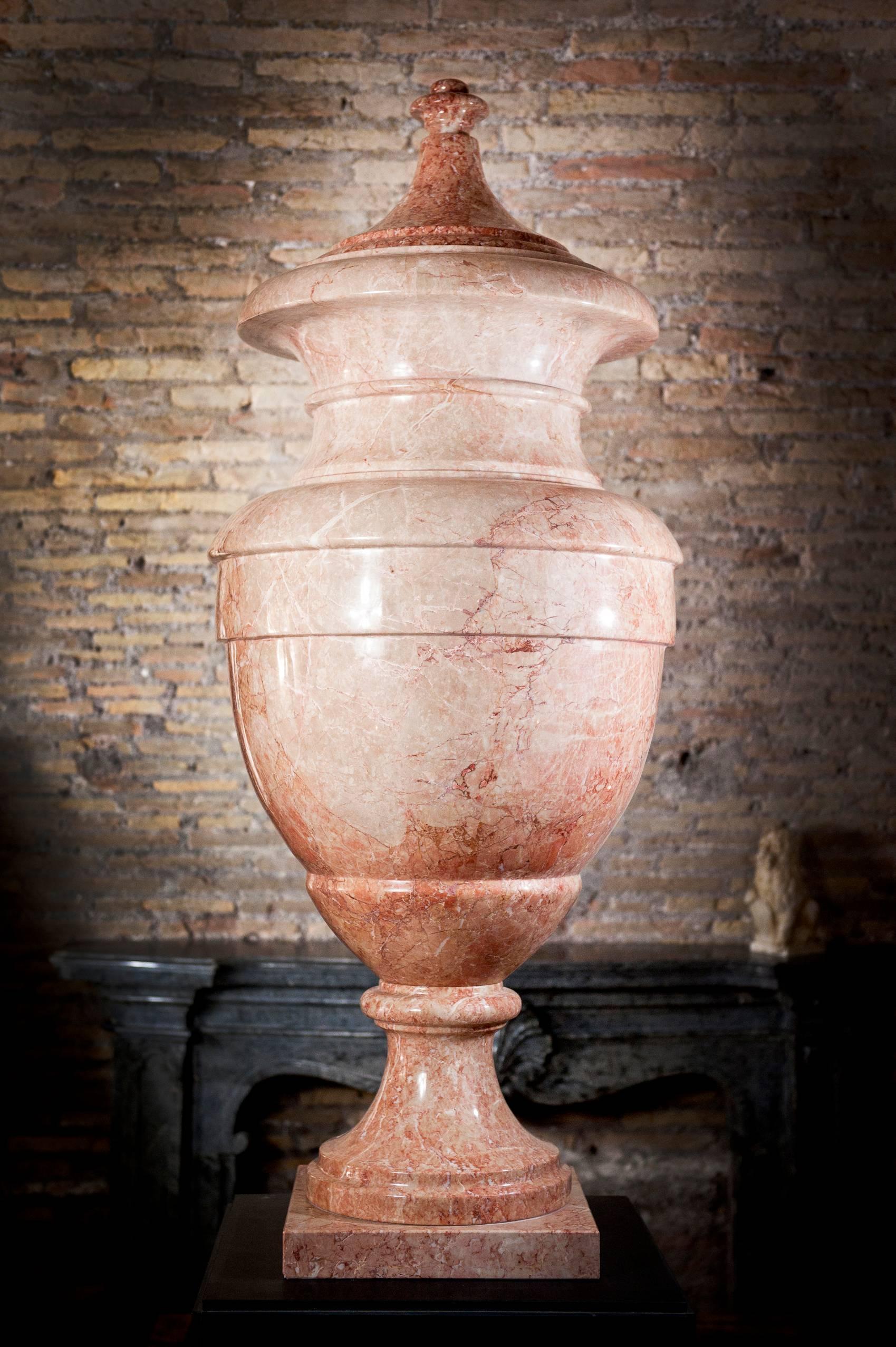 A superb and very impressive pair of Adam style marble vases. Made in royal pink marble a warm and exciting marble that preserve inside a fantastic range of shade of colors, from pink to red, from white to light grey, look like an impressionist