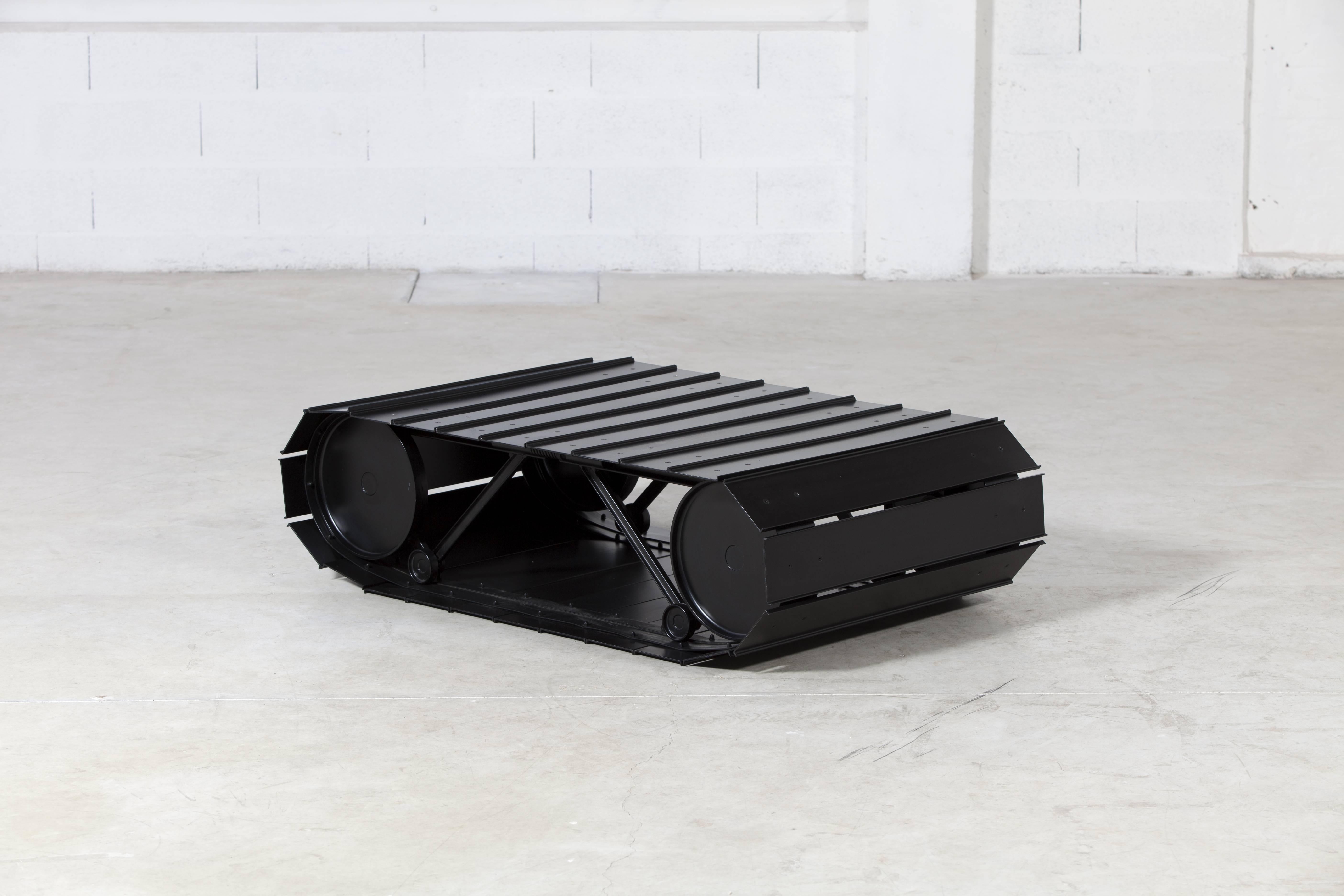 Tankette as indicated by its name unites a warlike form, that of a tank, with the domestic world. Reflecting the work of Paolo Pallucco and Mireille Rivier, Tankette combines irony and pessimism. Steel profile structure. The aluminium profile outer