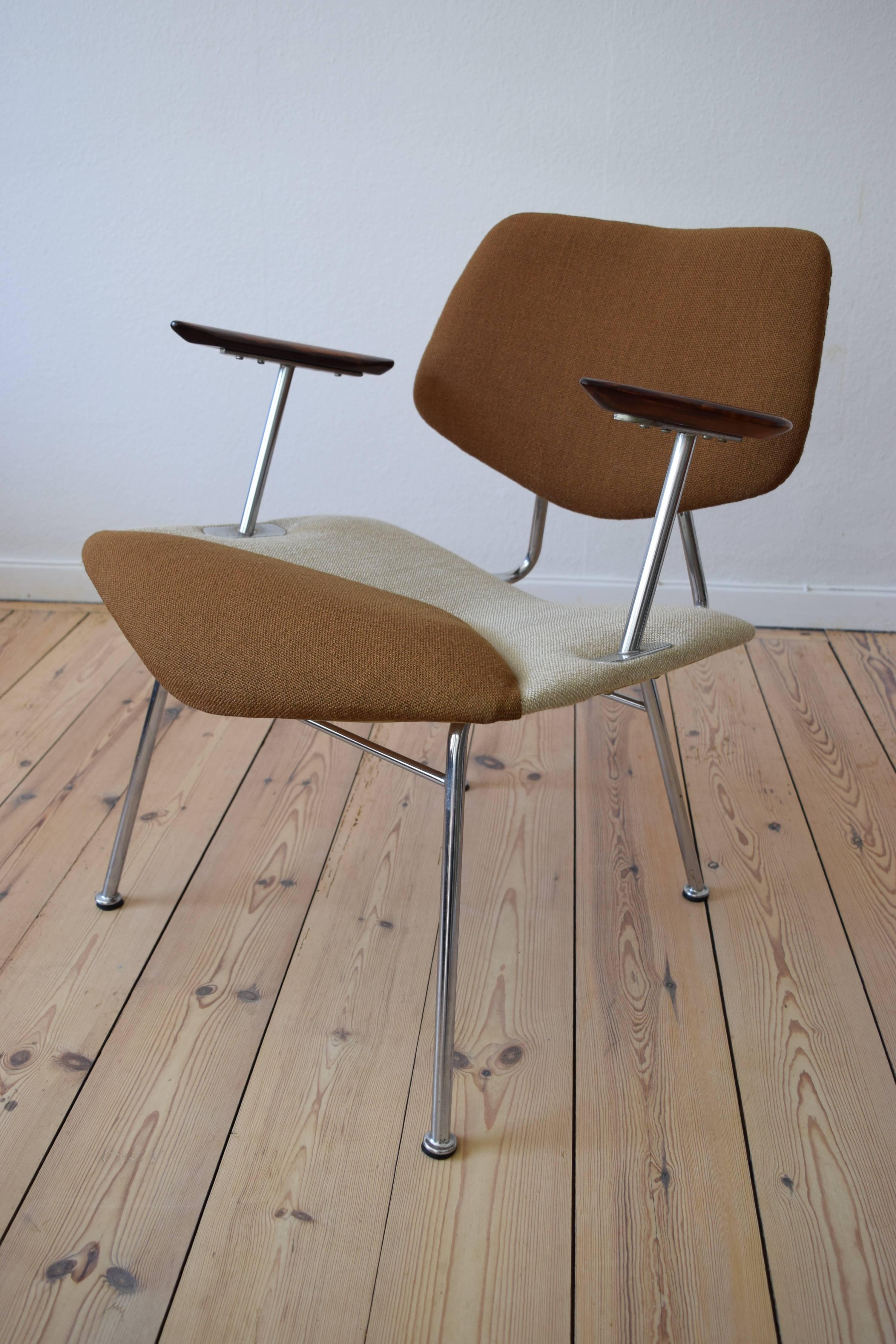 This pair of studio chairs were designed by Vermund Larsen for V.L. Møbler in Denmark during the 1960s. These chairs feature a swivel back, original wool two-tone upholstery and solid rosewood armrests. They are marked on the underside as being