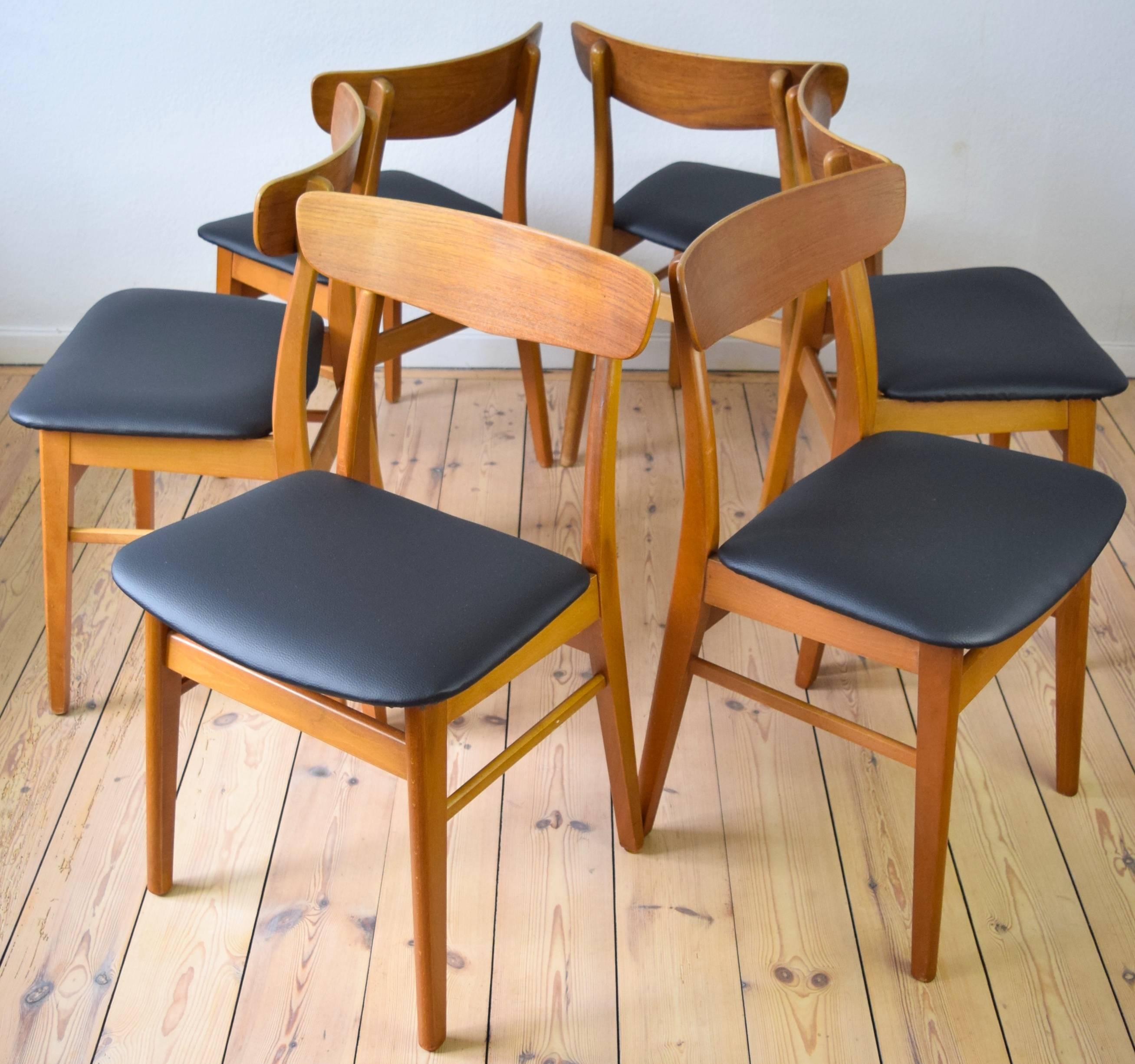 Beautifully restored V back dining chairs by Farstrup. A great Danish Classic that stands the test of time. A perfect addition to the home with warm tones and neutral colors. Simple design in beech and teak. Newly restored.