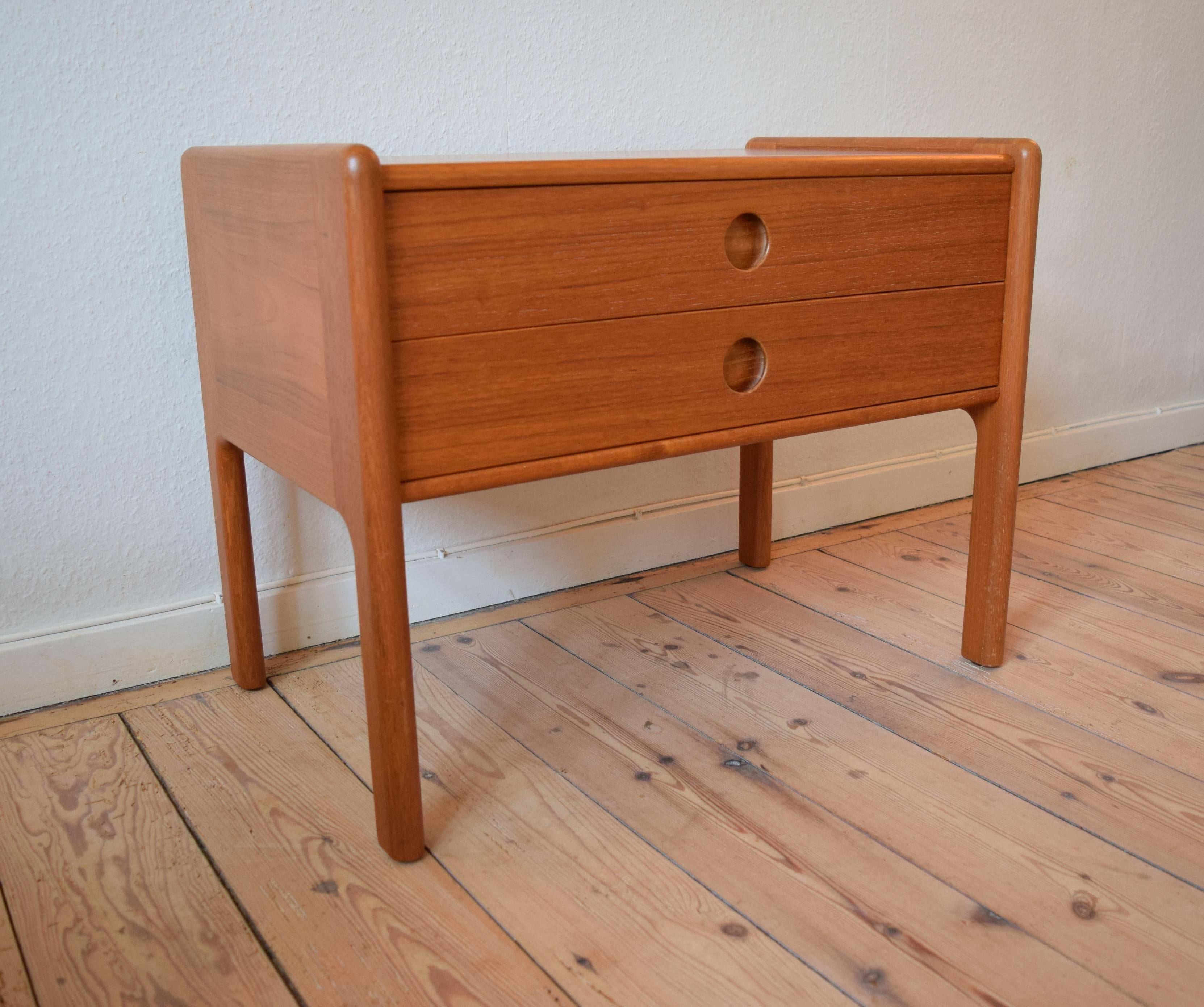 1960s Kai Kristiansen chest of drawers. Features two drawers with inset elliptical pulls and dovetailed drawer joinery. Manufactured by Vildbjerg Møbelfabrik, Denmark. This cabinet is made of teak and has beautiful detailed lines typical for