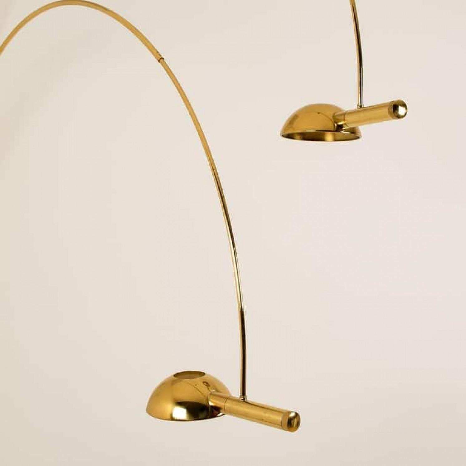 An exceptional, rare to find giant double ball floor lamp by Florian Schulz, Germany, 1970. This lamp is adjustable and can be pivoted in multiple positions, it is being designed for easily being clamped between ground and ceiling. It is made of