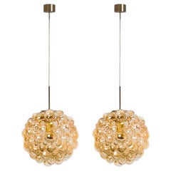 1 of the 2 Large Bubbled Glass and Brass Pendants by Helena Tynell, Germany 1970