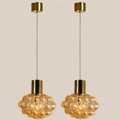 1 of the 2 Bubbled Glass and Brass Pendants by Helena Tynell, Germany 1970